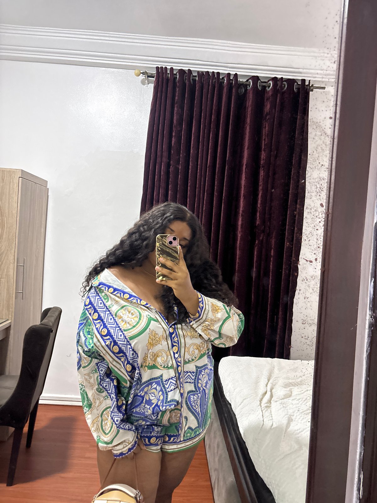 Woman takes selfies in Port Harcourt room