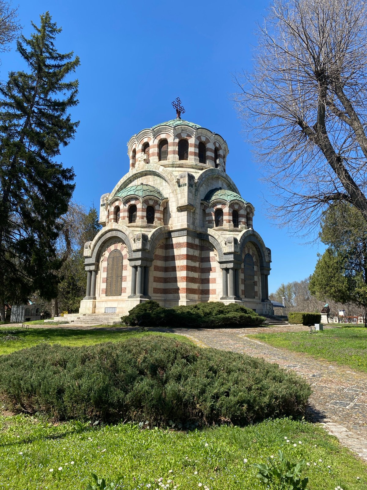 Tourist photographs historic mausoleum in Pleven, Bulgaria