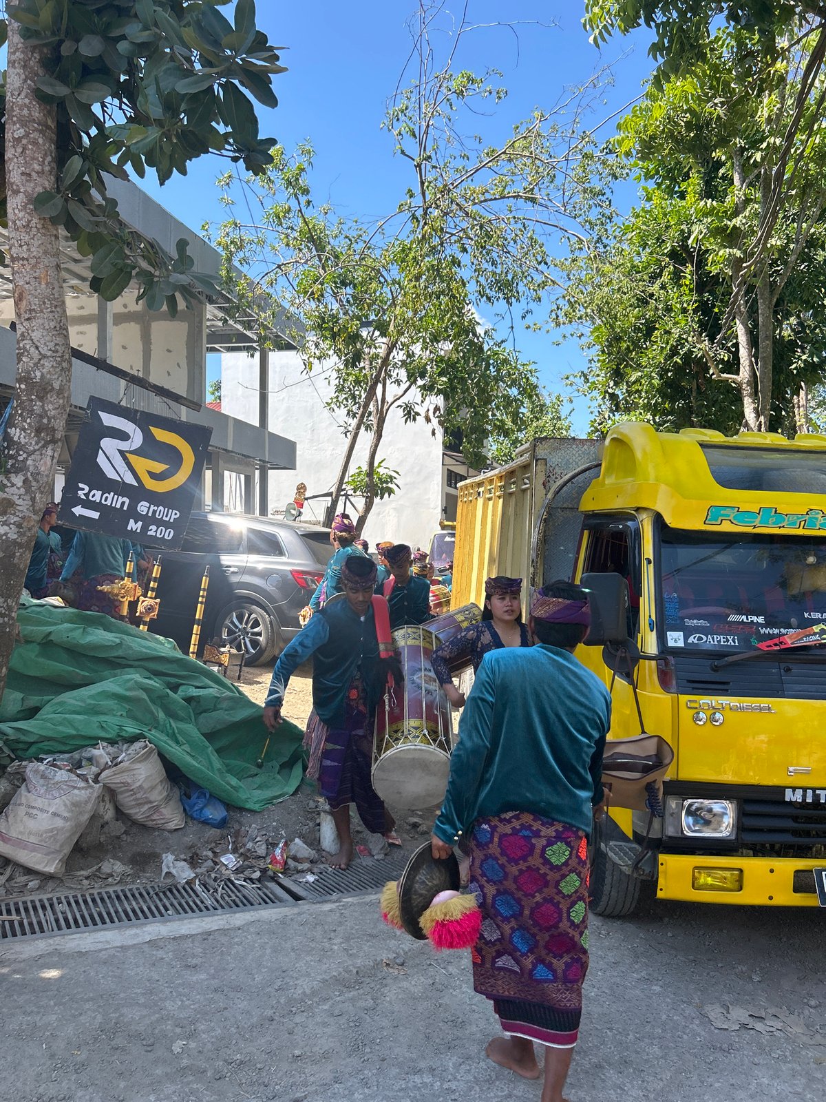 Traditional drum procession and sound system setup in Kuta, Indonesia