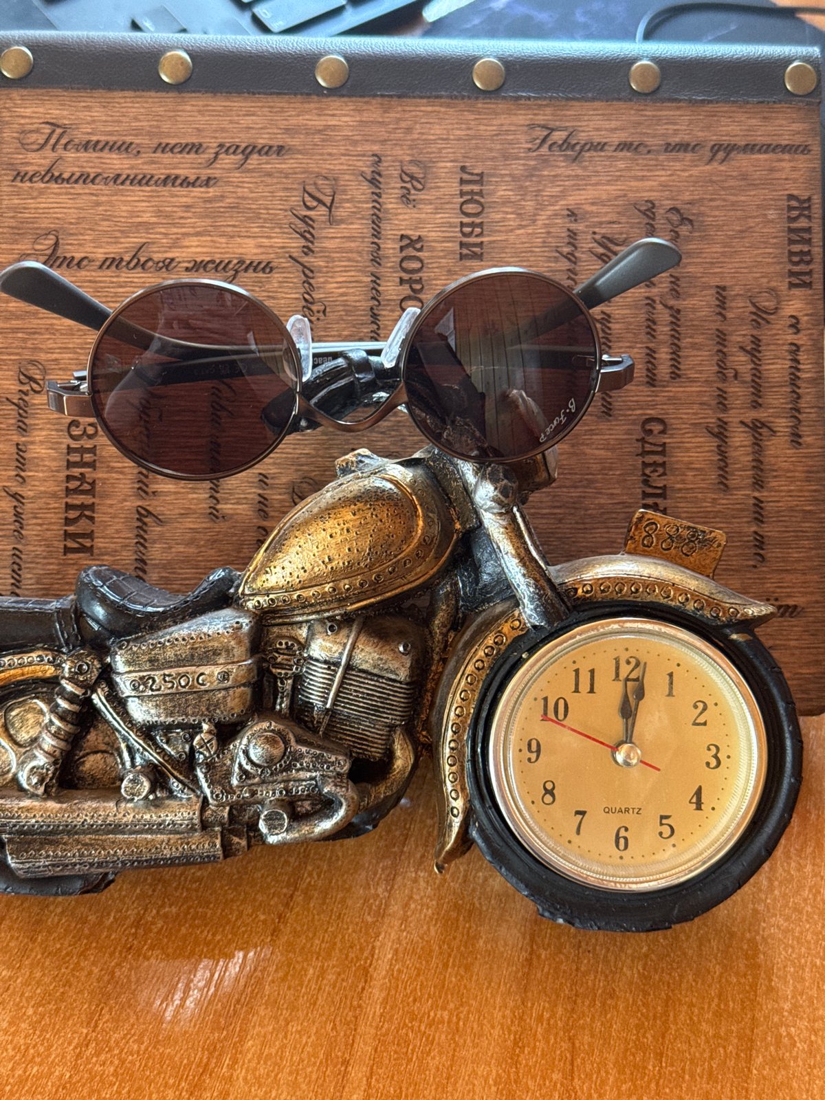 Eclectic shelf display of clocks, daggers, figurines, and collectibles