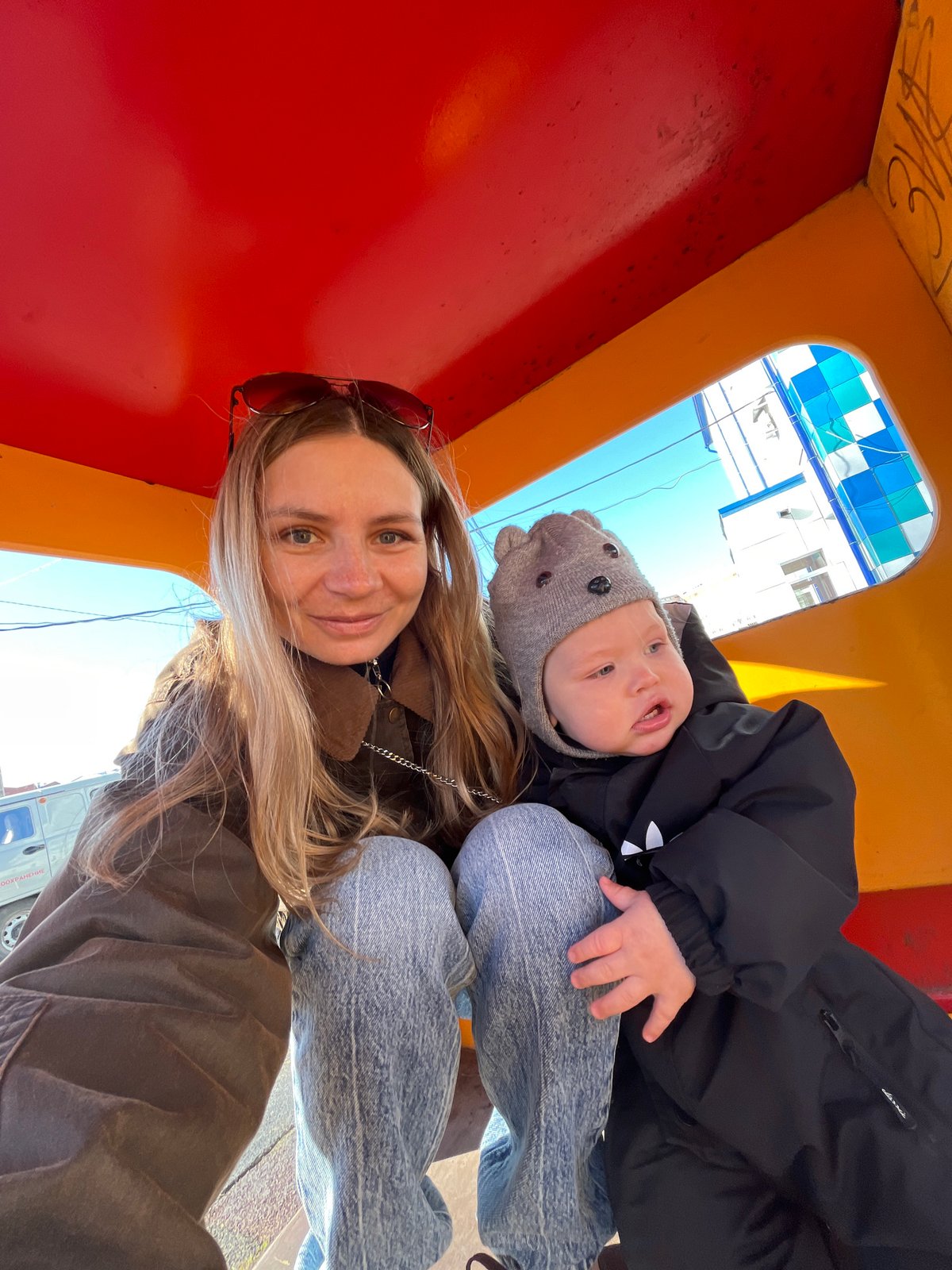 Mother and baby enjoy playground visit in Chaikovsky, Russia