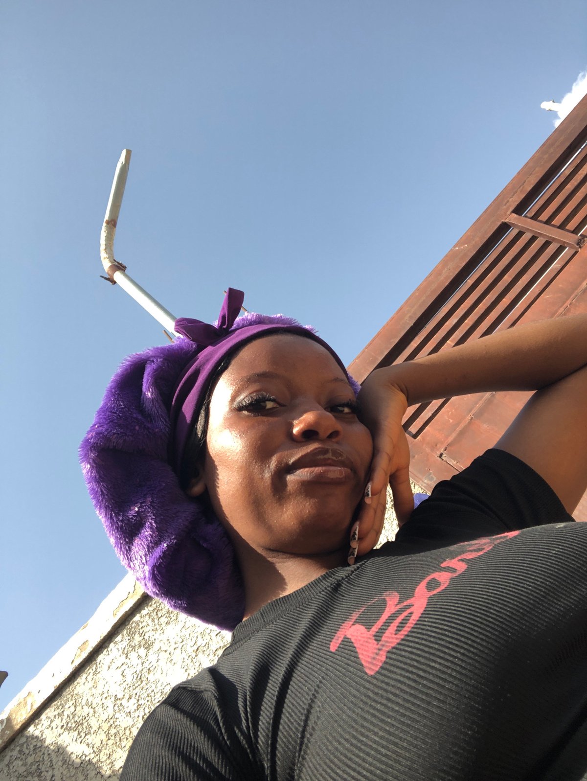 Afternoon selfie session outdoors in Nigeria, purple bonnet series
