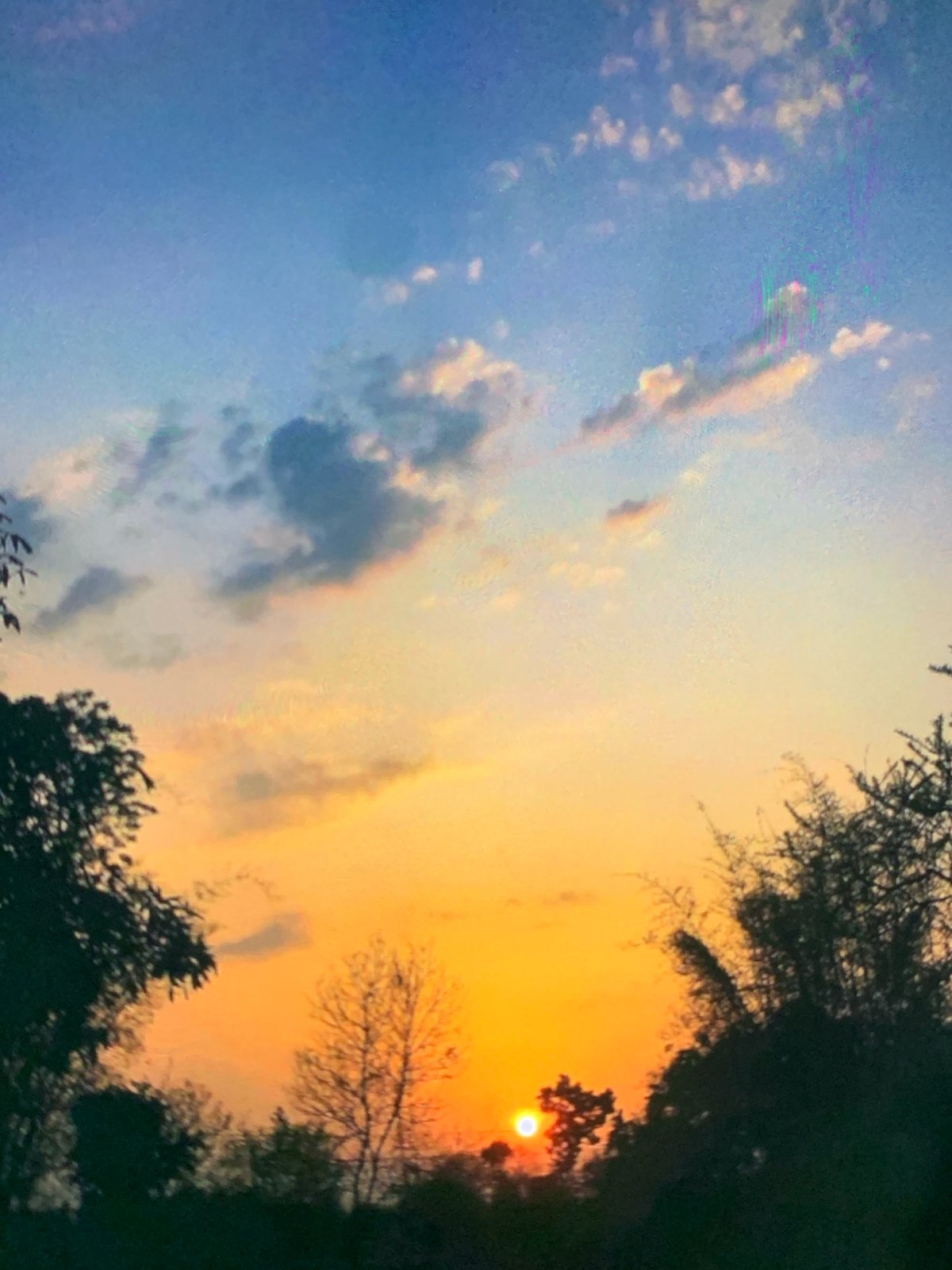 Vibrant sunset displays dramatic colors over Dar es-Salaam skyline