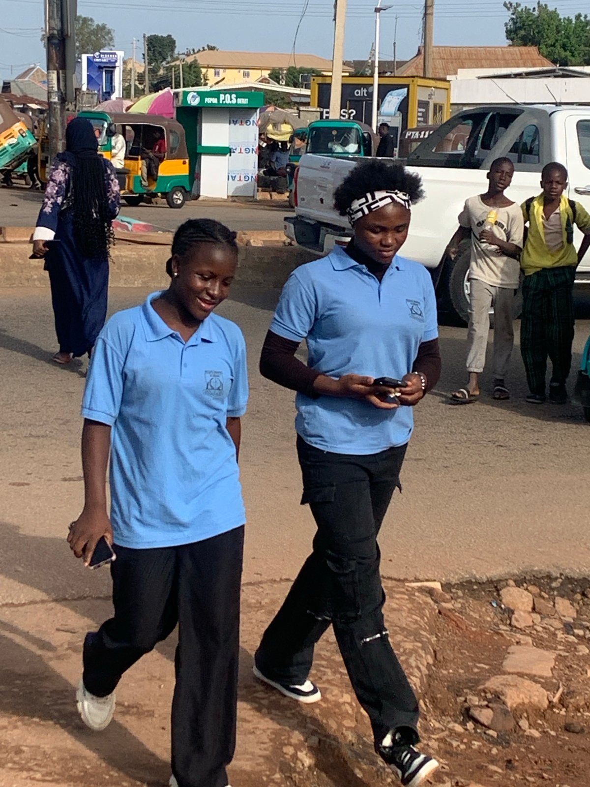 Morning foot traffic and daily errands in Gura Top, Nigeria