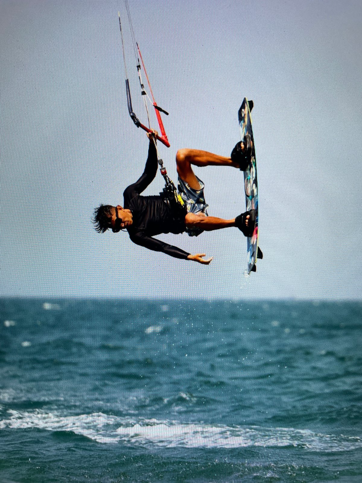 Kitesurfer performs aerial tricks off Bacong, Philippines coast