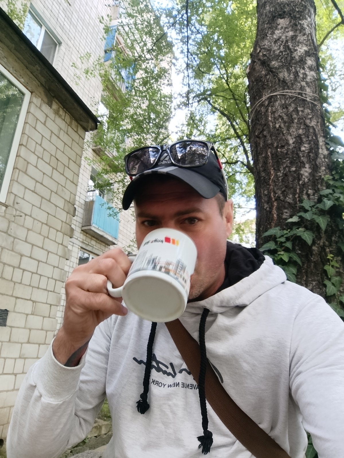 Morning coffee break in Ladyzhyn, scooter parked nearby