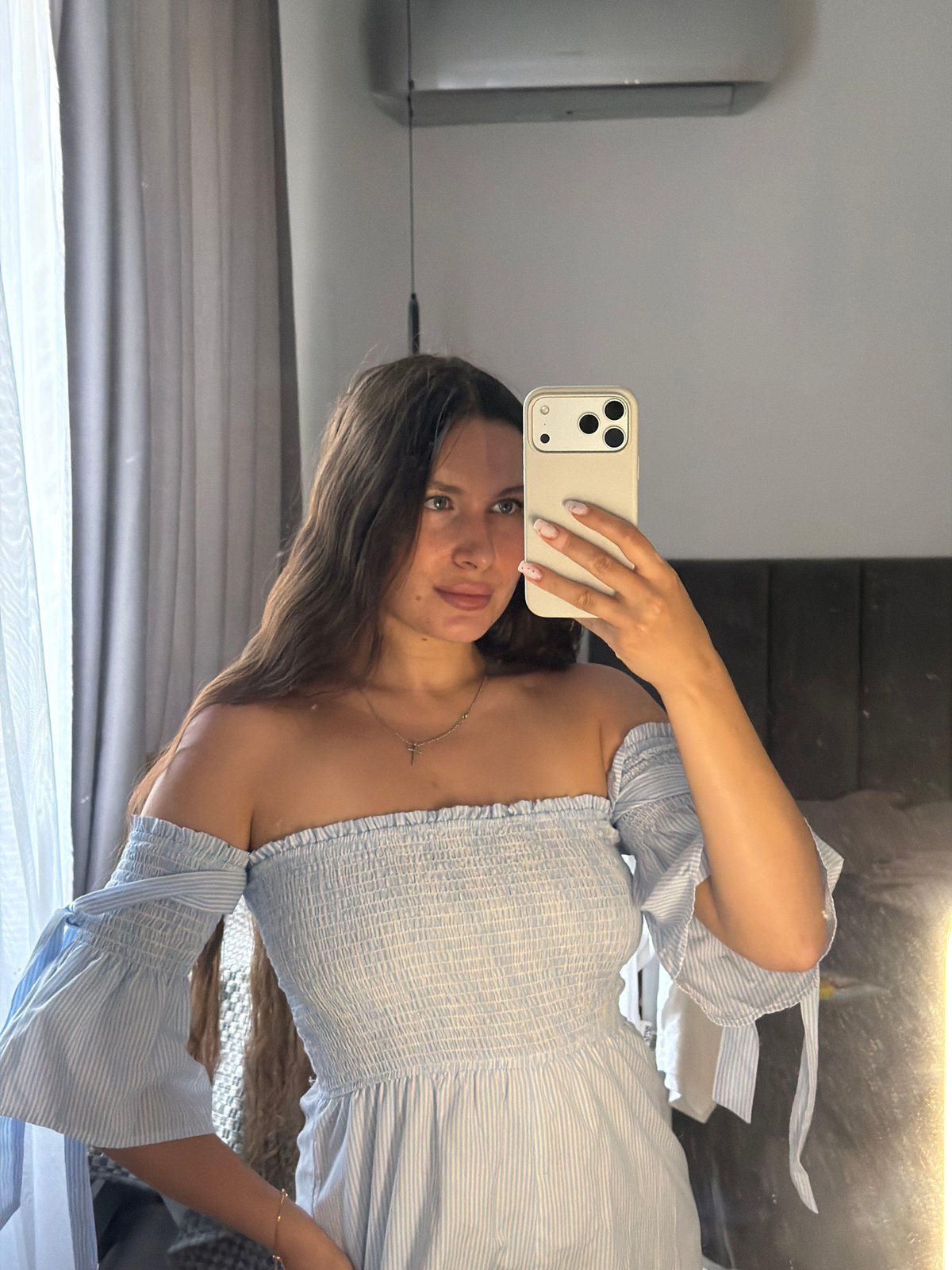 Indoor portrait session in a Moscow suburb, light blue striped top
