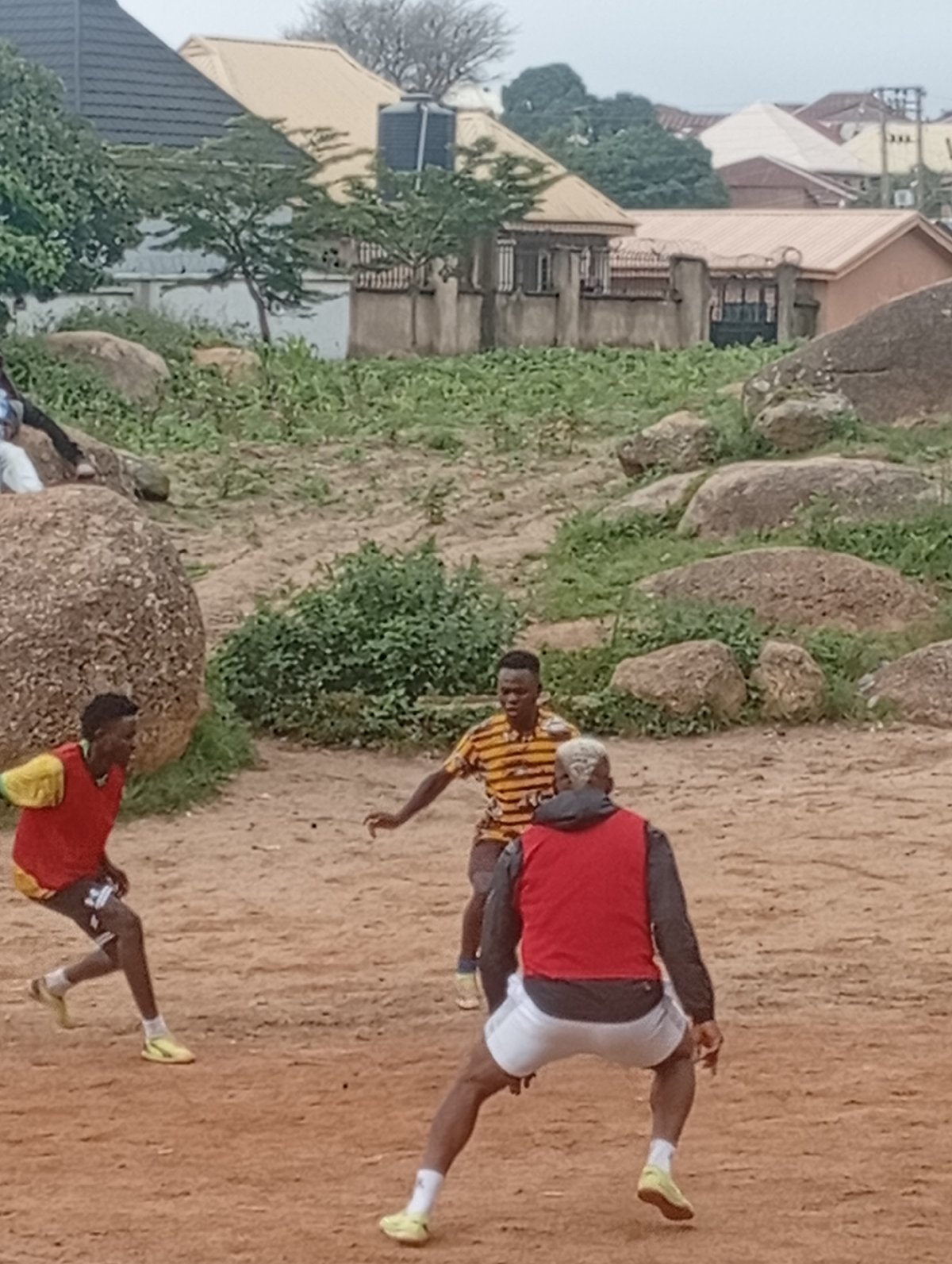Pickup football on a dirt pitch in Jos, Nigeria