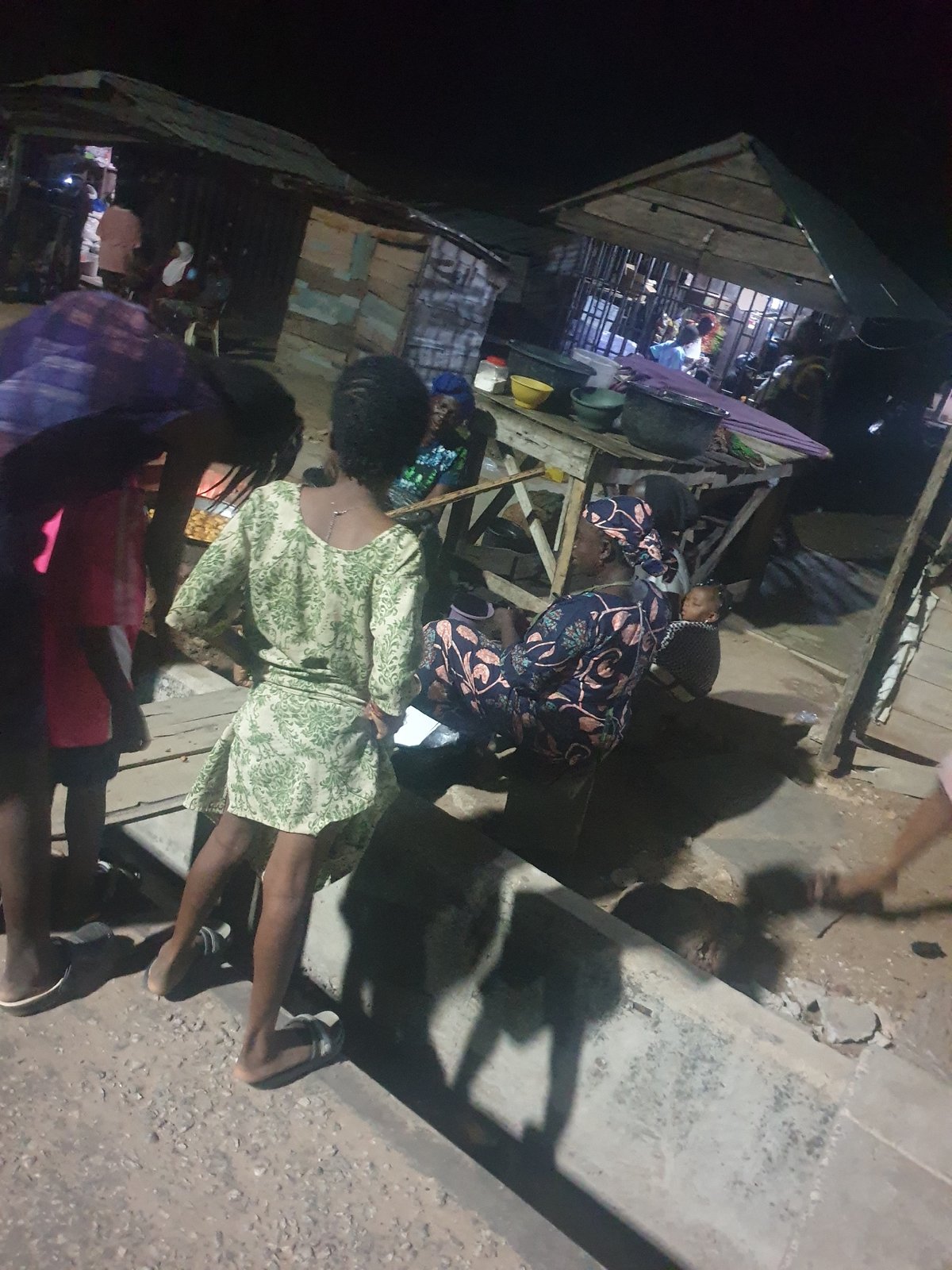 Two people spotted in nighttime urban setting
