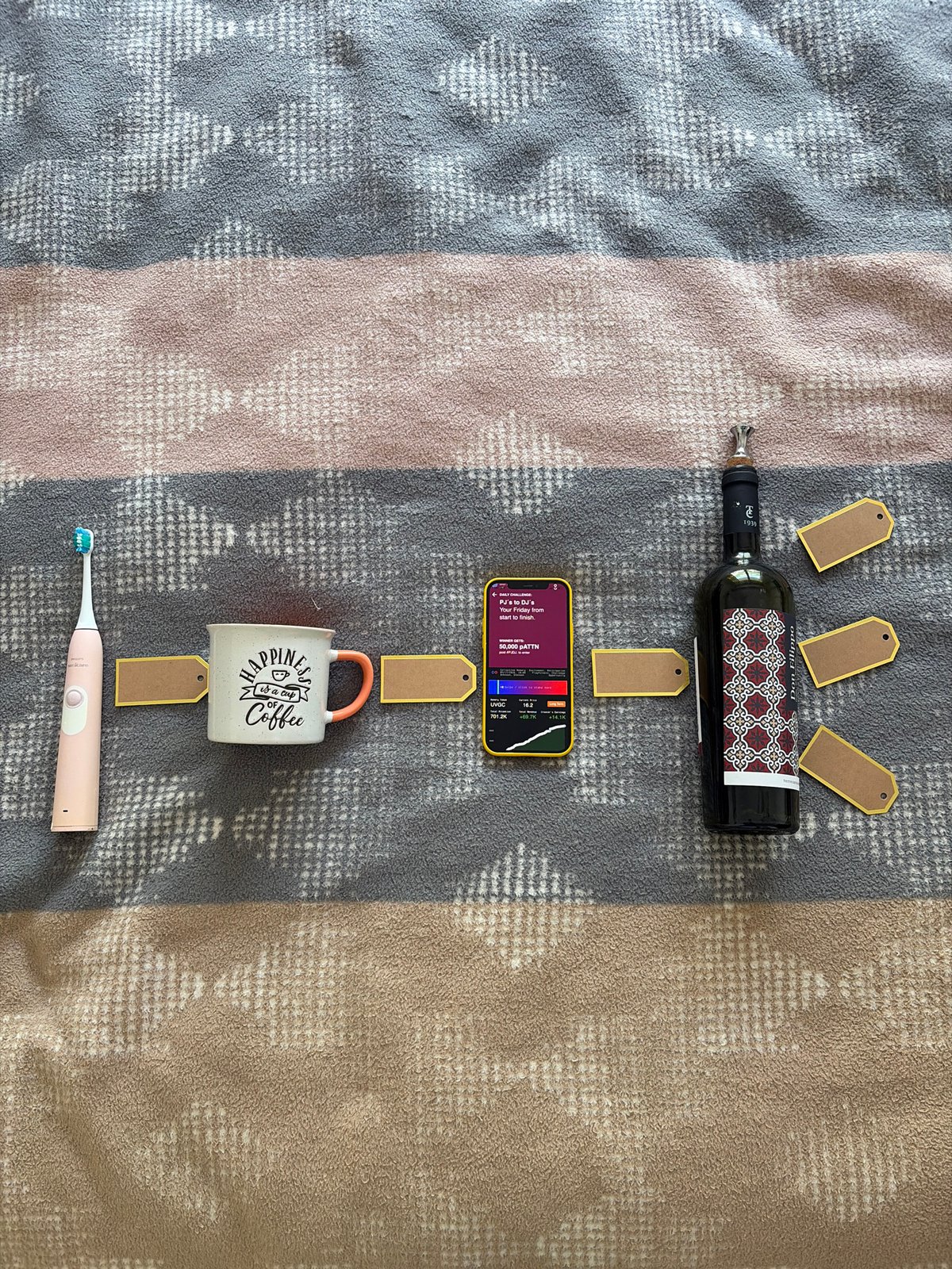 Personal items arranged on blanket in Budva, Montenegro