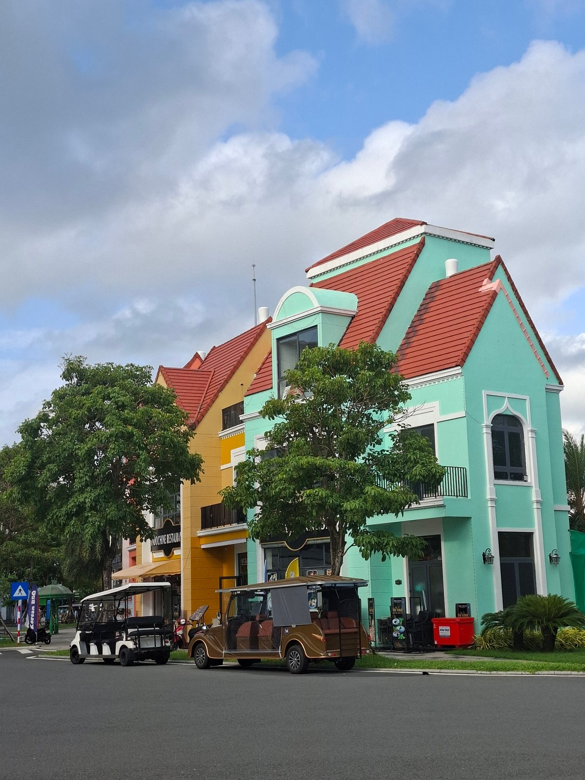 Colorful waterfront resort town with clock tower and European architecture