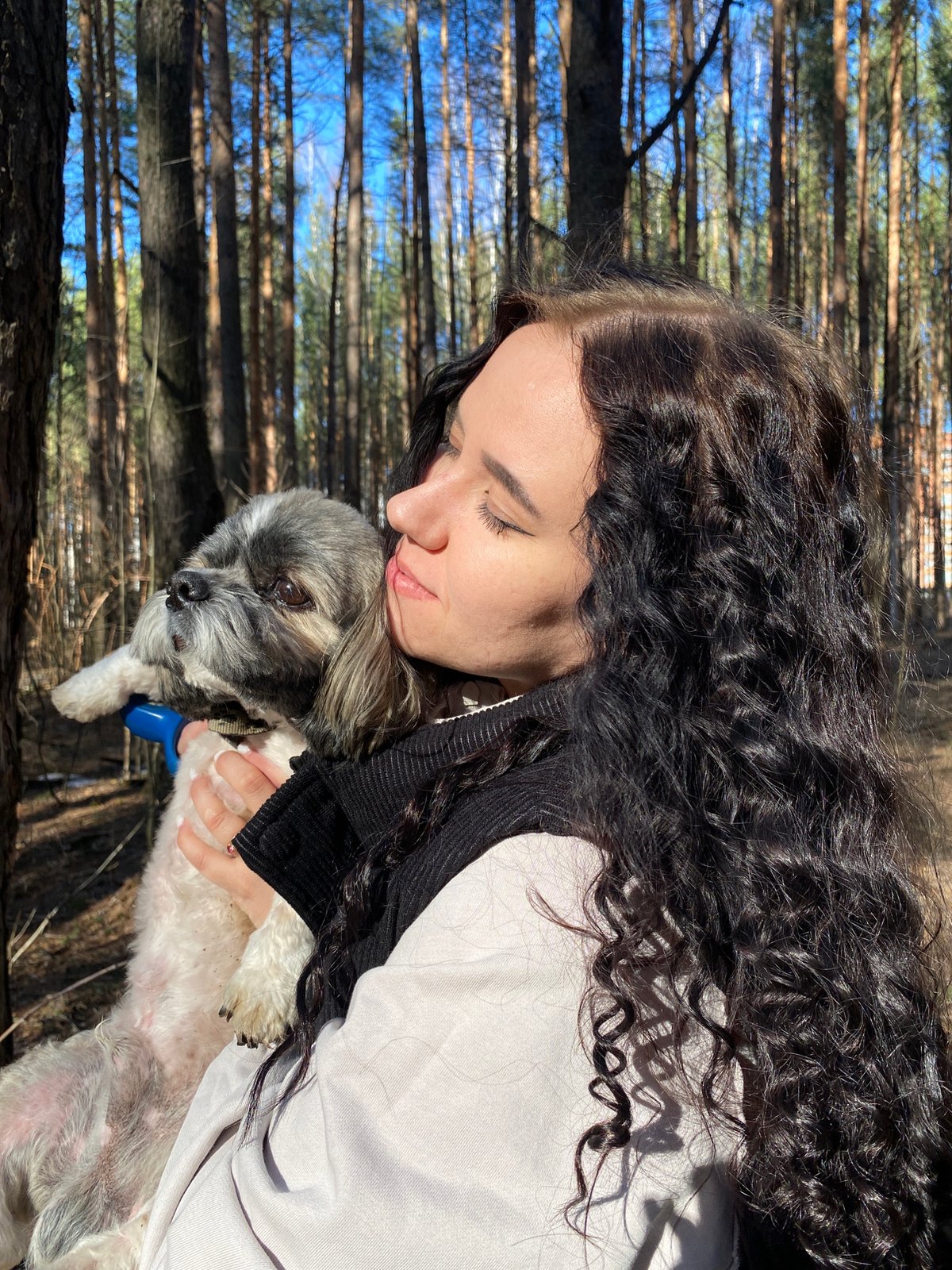 Women enjoy woodland outing with dog in Chaikovsky