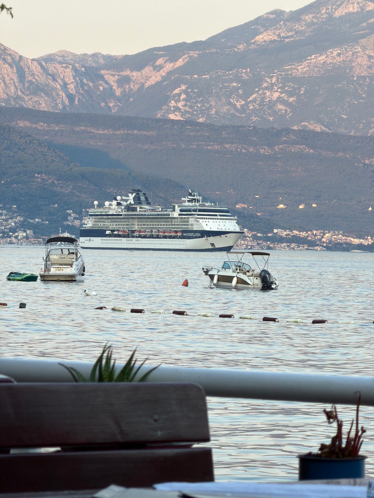 Waterfront dining with Celebrity Constellation in the bay, Đenovići