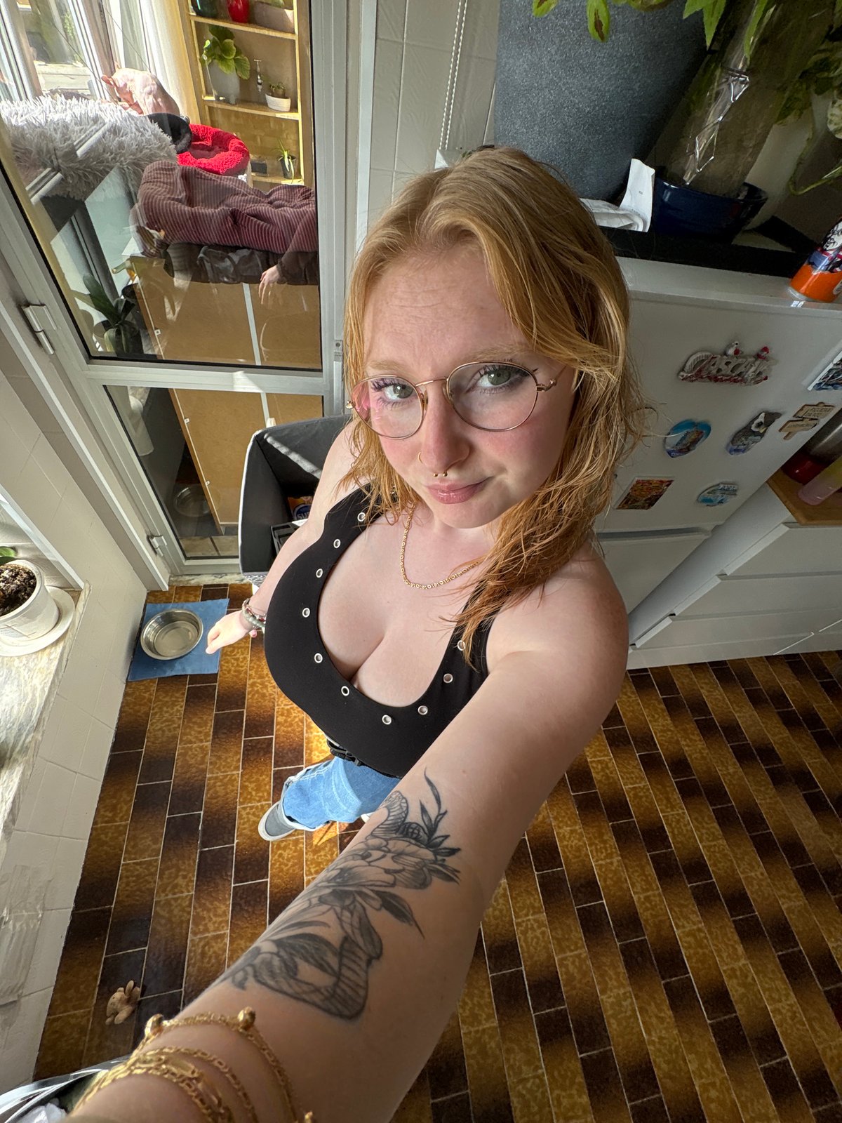Person takes multiple selfies indoors within one minute timeframe