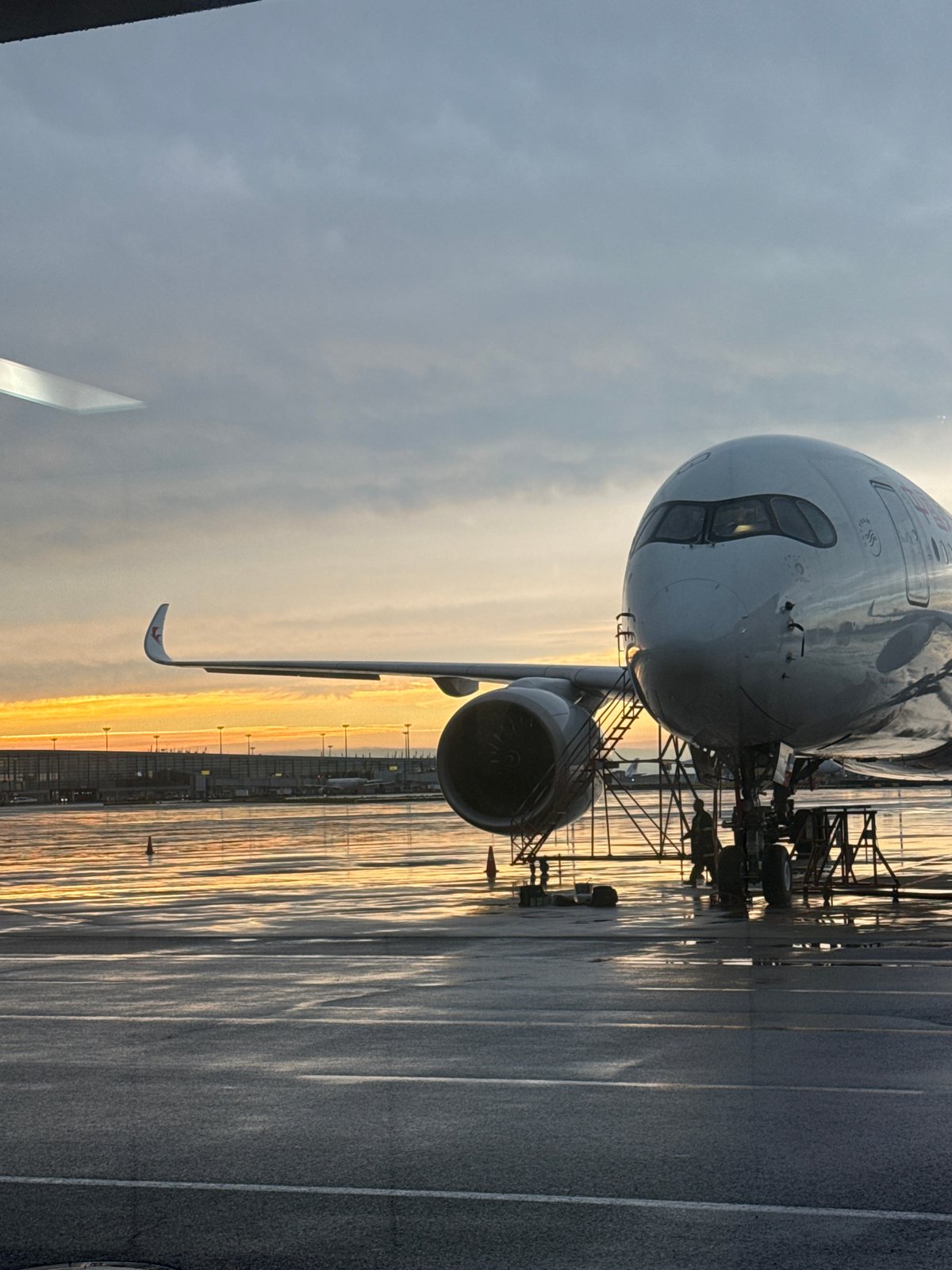 Rainy evening at Pudong Airport, tarmac and security checkpoint