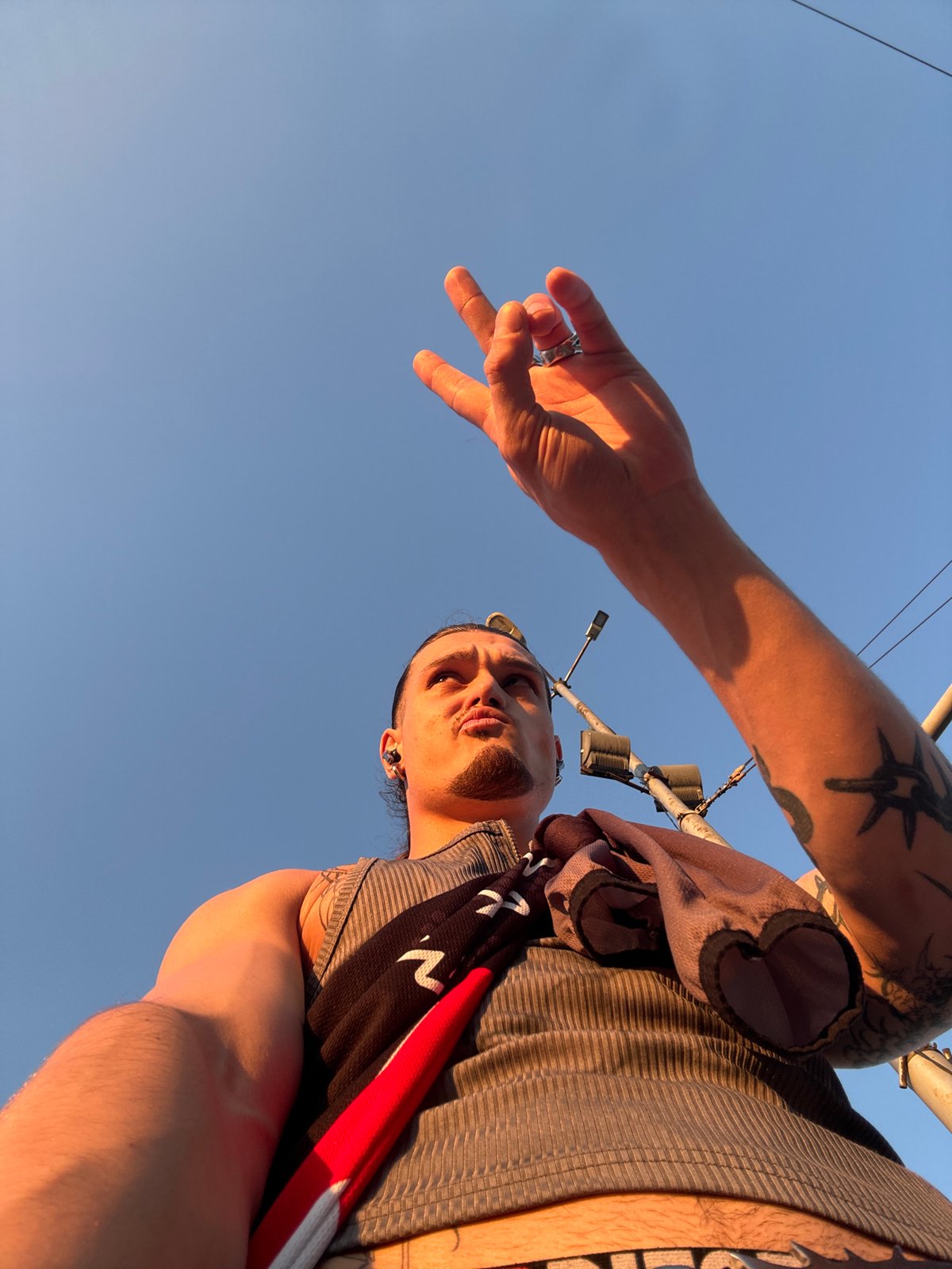 Young man photographed with roses during Sofia sunset