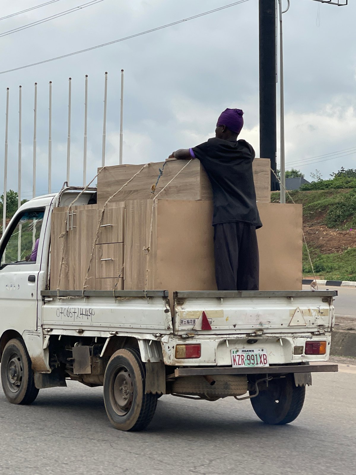 Furniture transport and street traffic near Bourdillon, Abuja