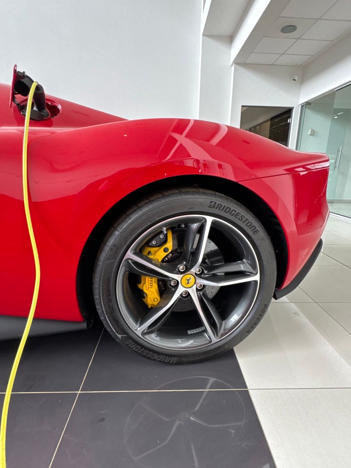 Young woman visits Ferrari dealership in Sofia, takes selfies
