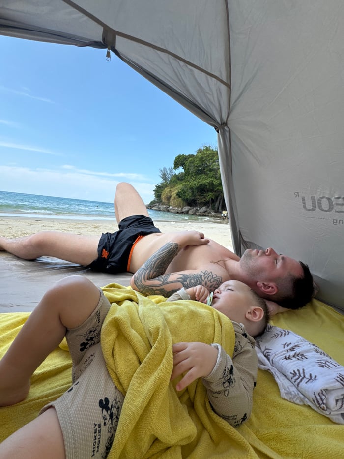 Family enjoys morning beach day at Karon, Thailand