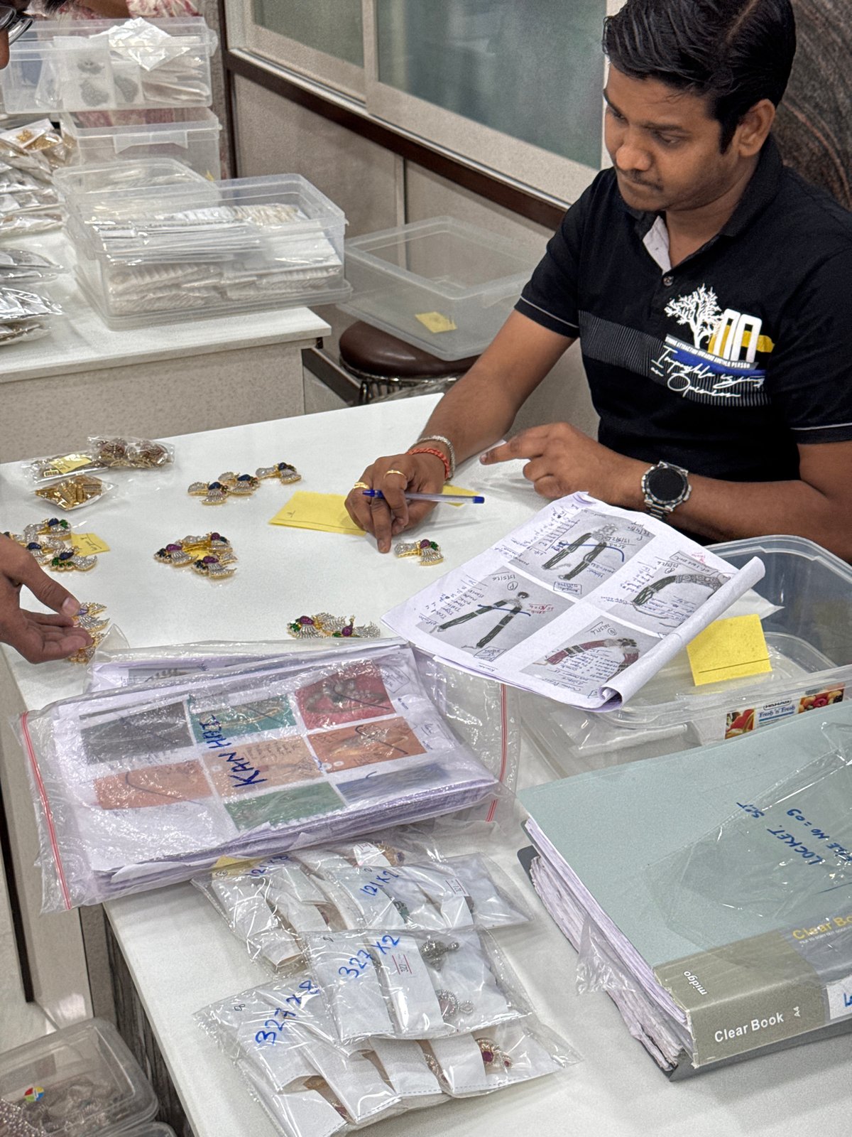 Jewelry designer works on inventory and takes selfies in Kolkata