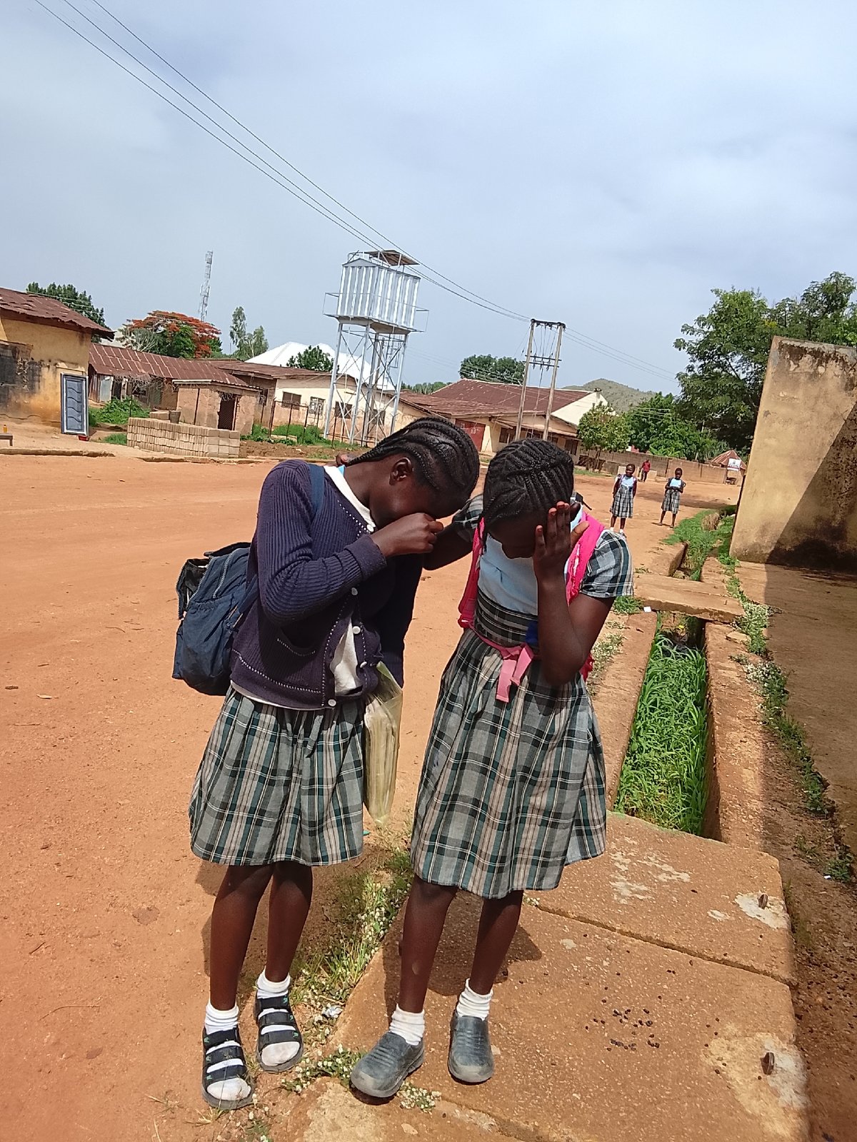 Children photographed in playful moments at same location