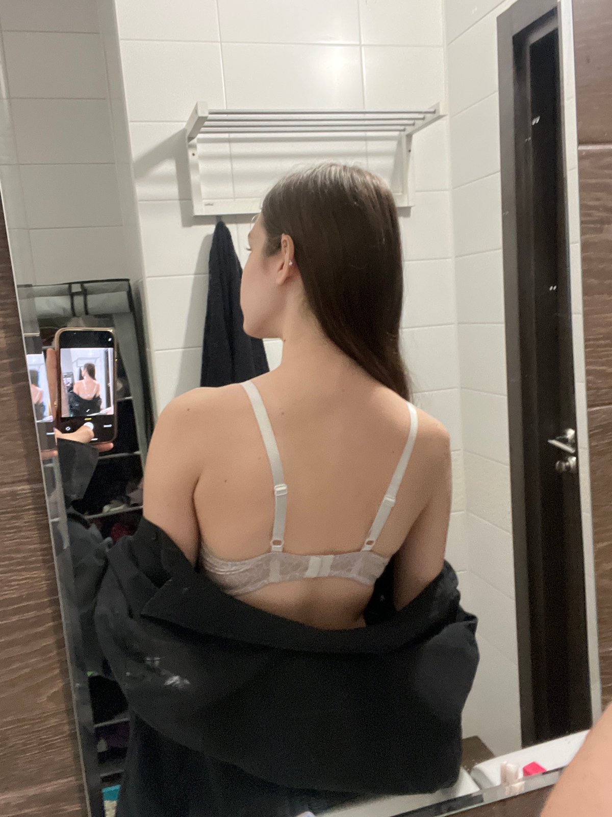 Woman takes bathroom mirror selfies in Saint Petersburg