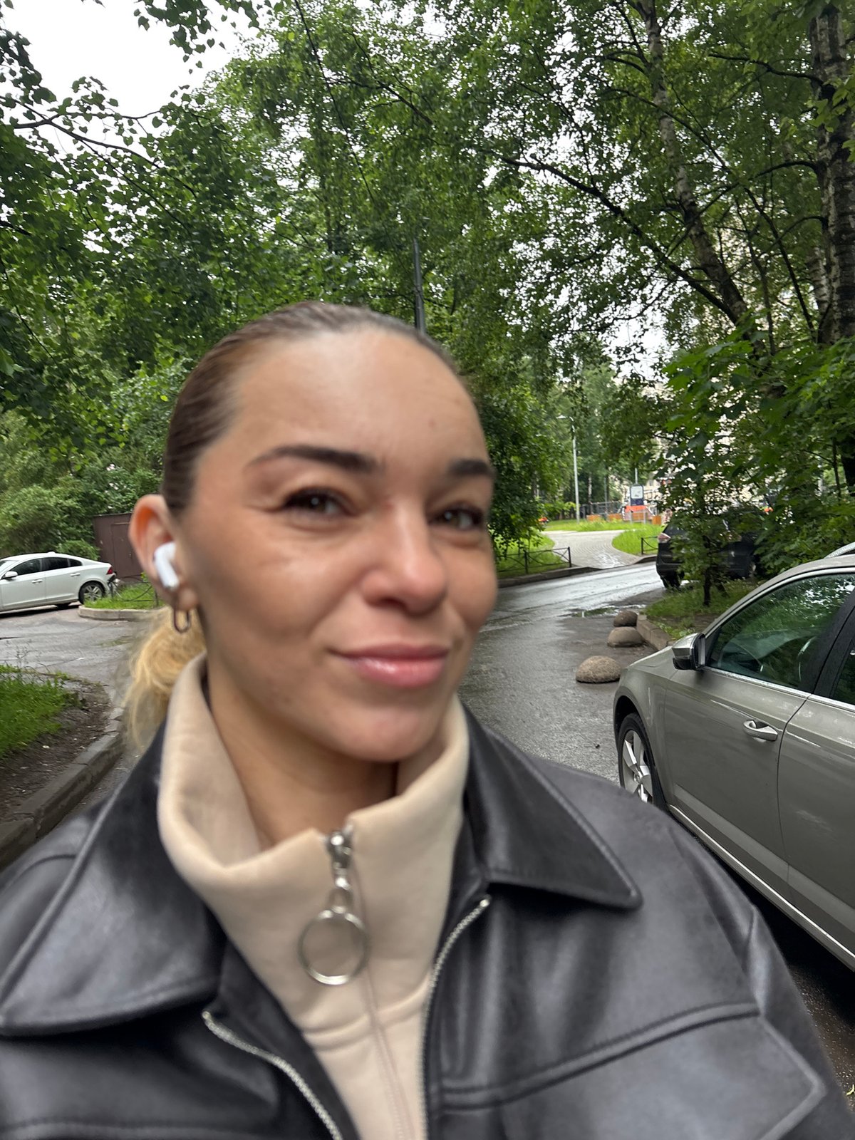 Selfie session on a Vsevolozhsk walkway, June morning