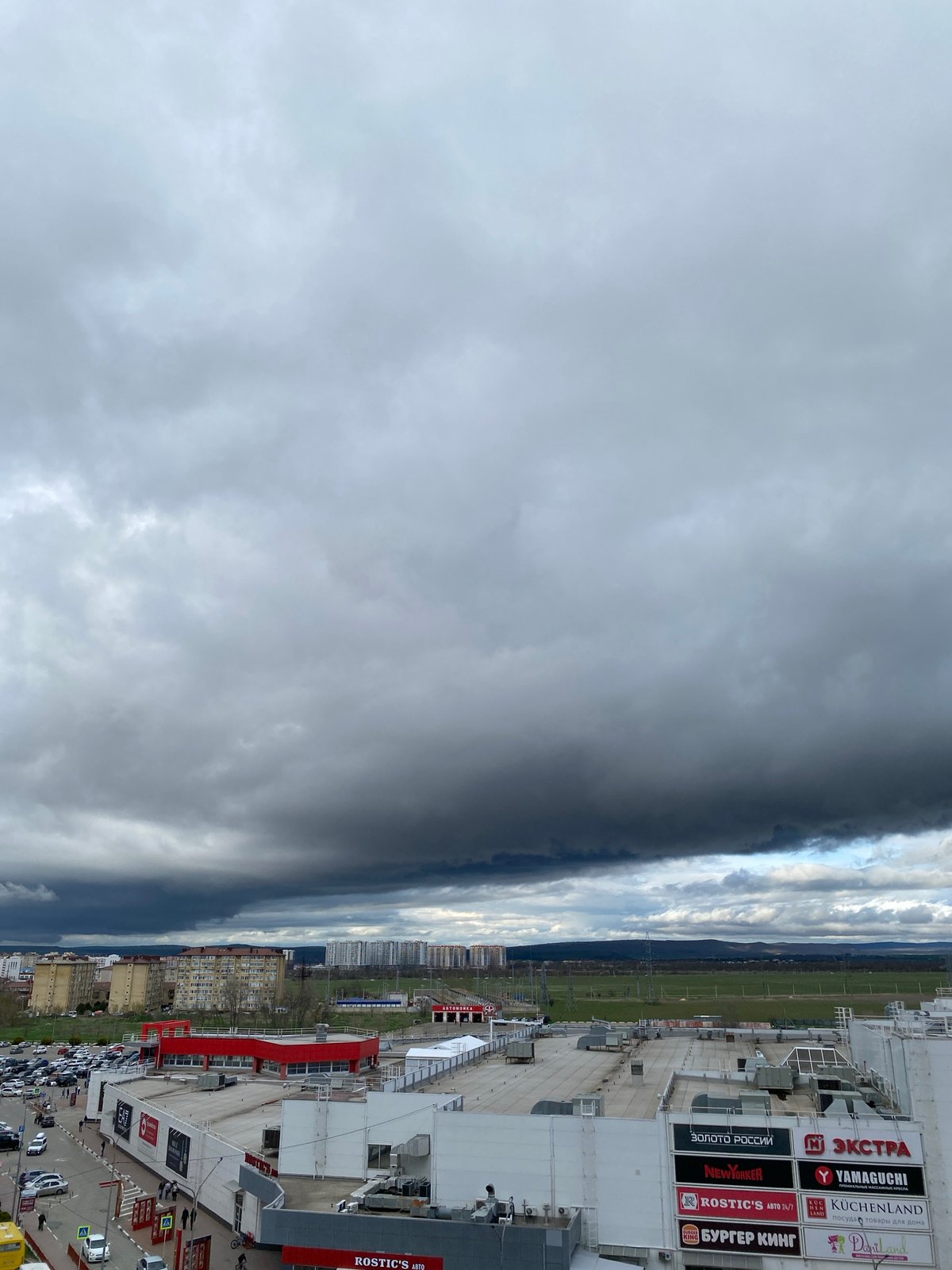 Dark skies observed over Anapa cityscape from elevated viewpoint