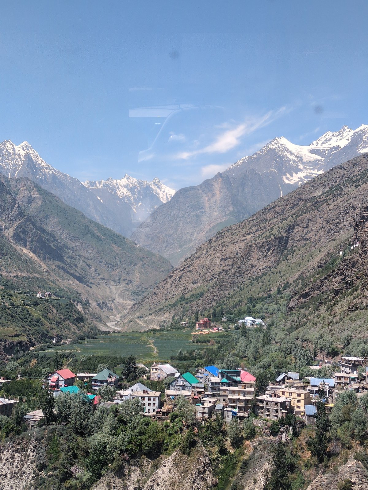 Keylong village nestled in a Himalayan valley below snowy peaks