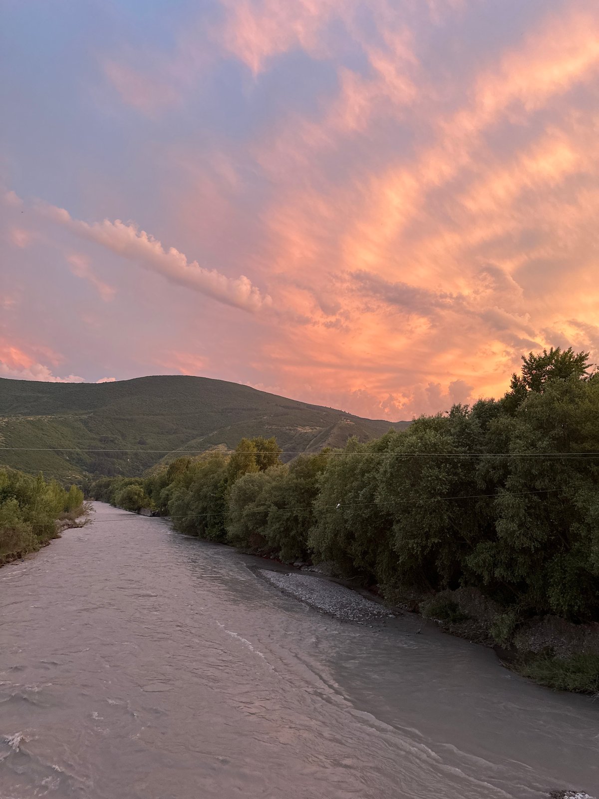 Sunset over Gori's rivers, forests, and mountain ridges