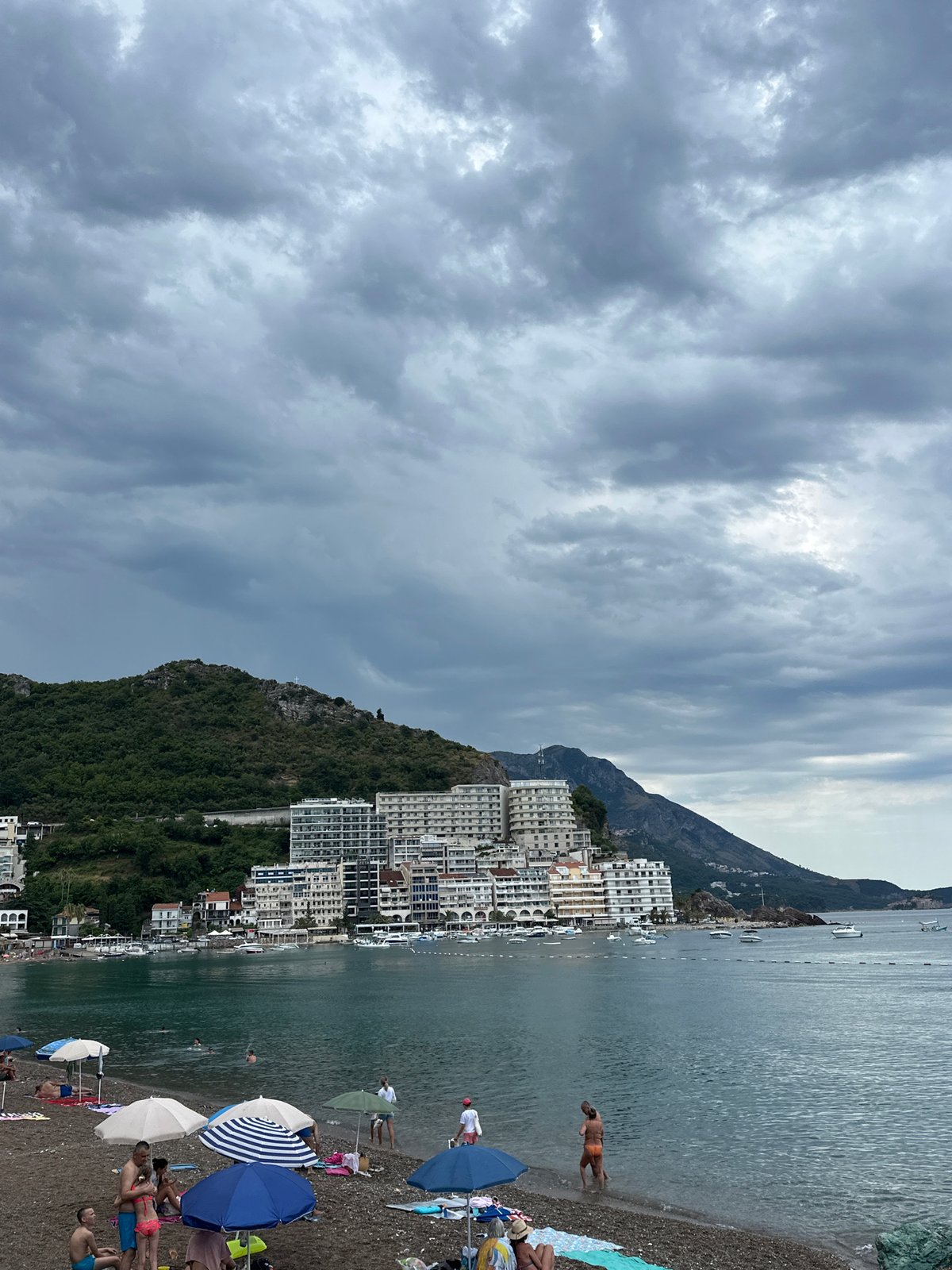 Quiet cloudy morning on the pebble beach in Rafailovići