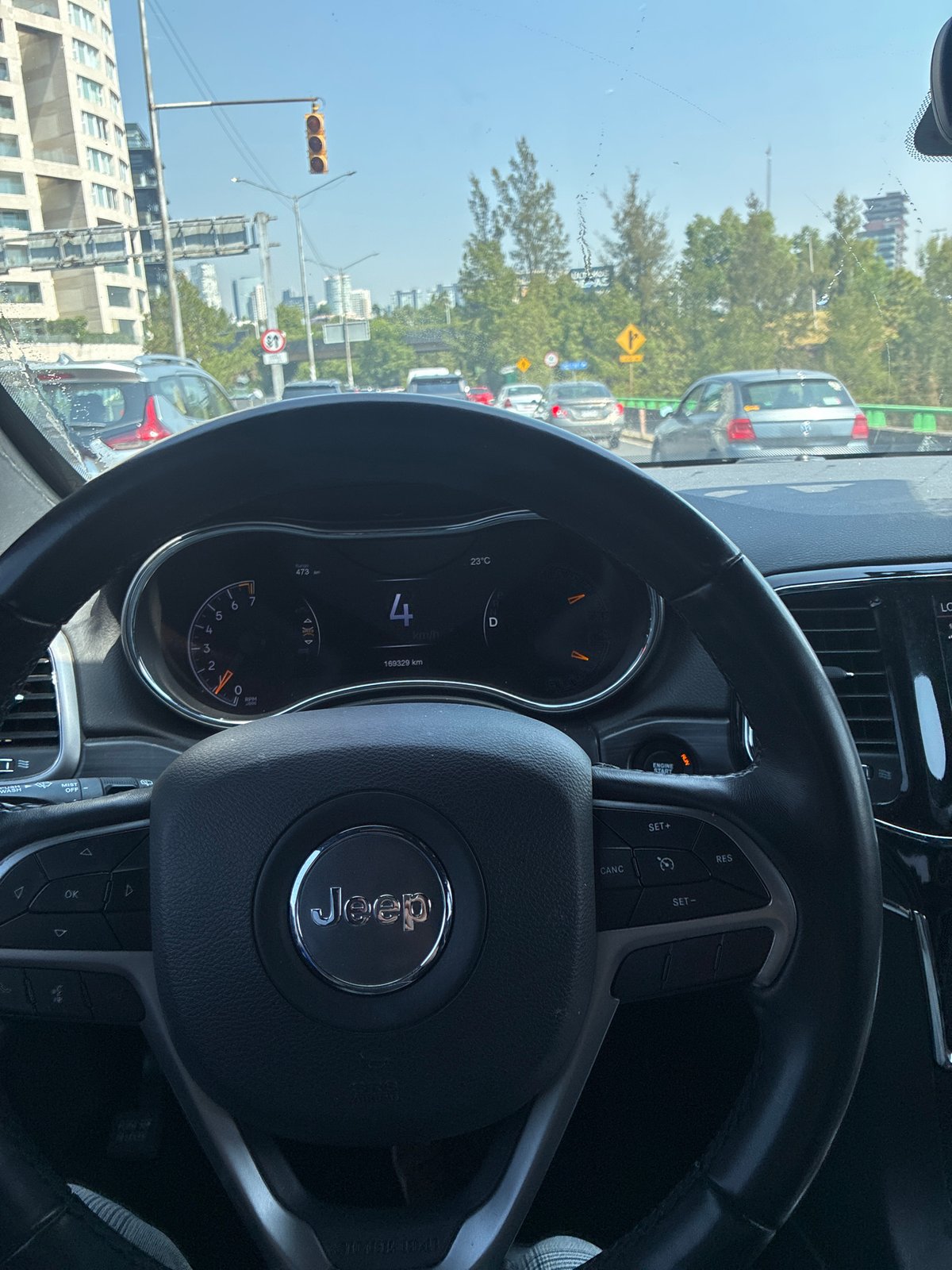 Jeep traveling slowly through Mexico City streets