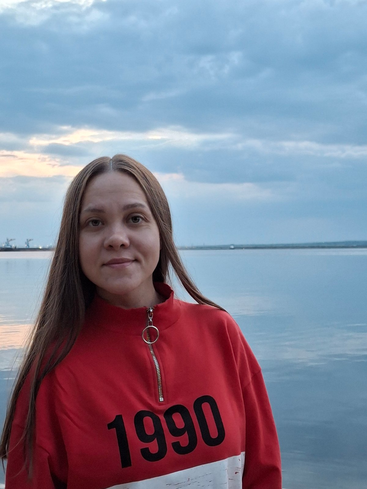 Casual riverside recreation documented in Chaikovsky, Russia waterfront area