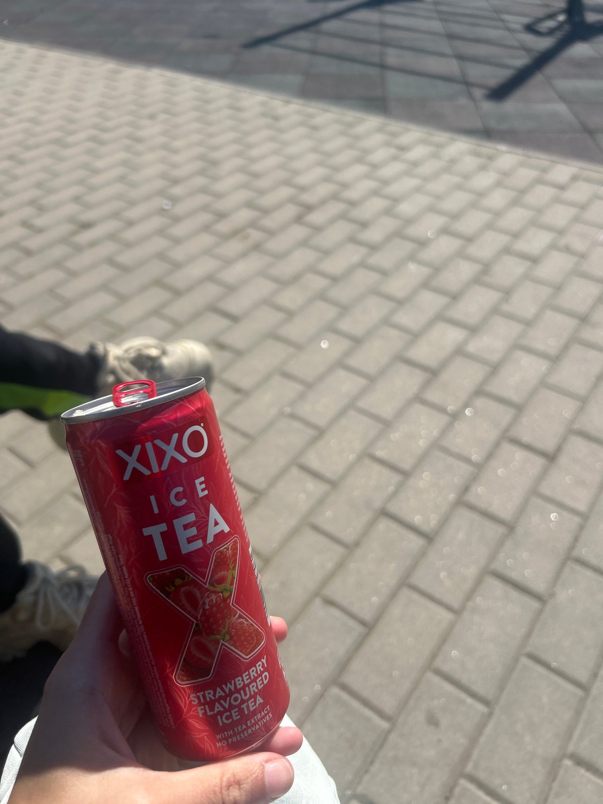 Person enjoys strawberry ice tea on Burgas walkway