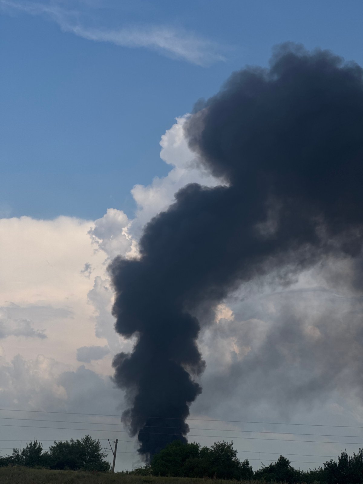 Heavy black smoke billows into clear sky over Bozhurishte