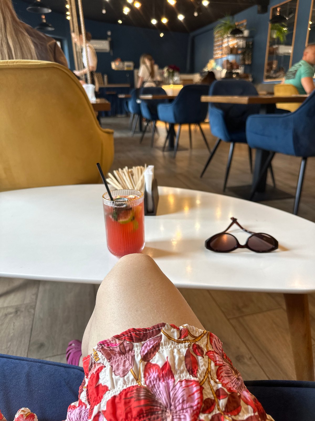 Woman enjoys red drink at Kryvyi Rih cafe