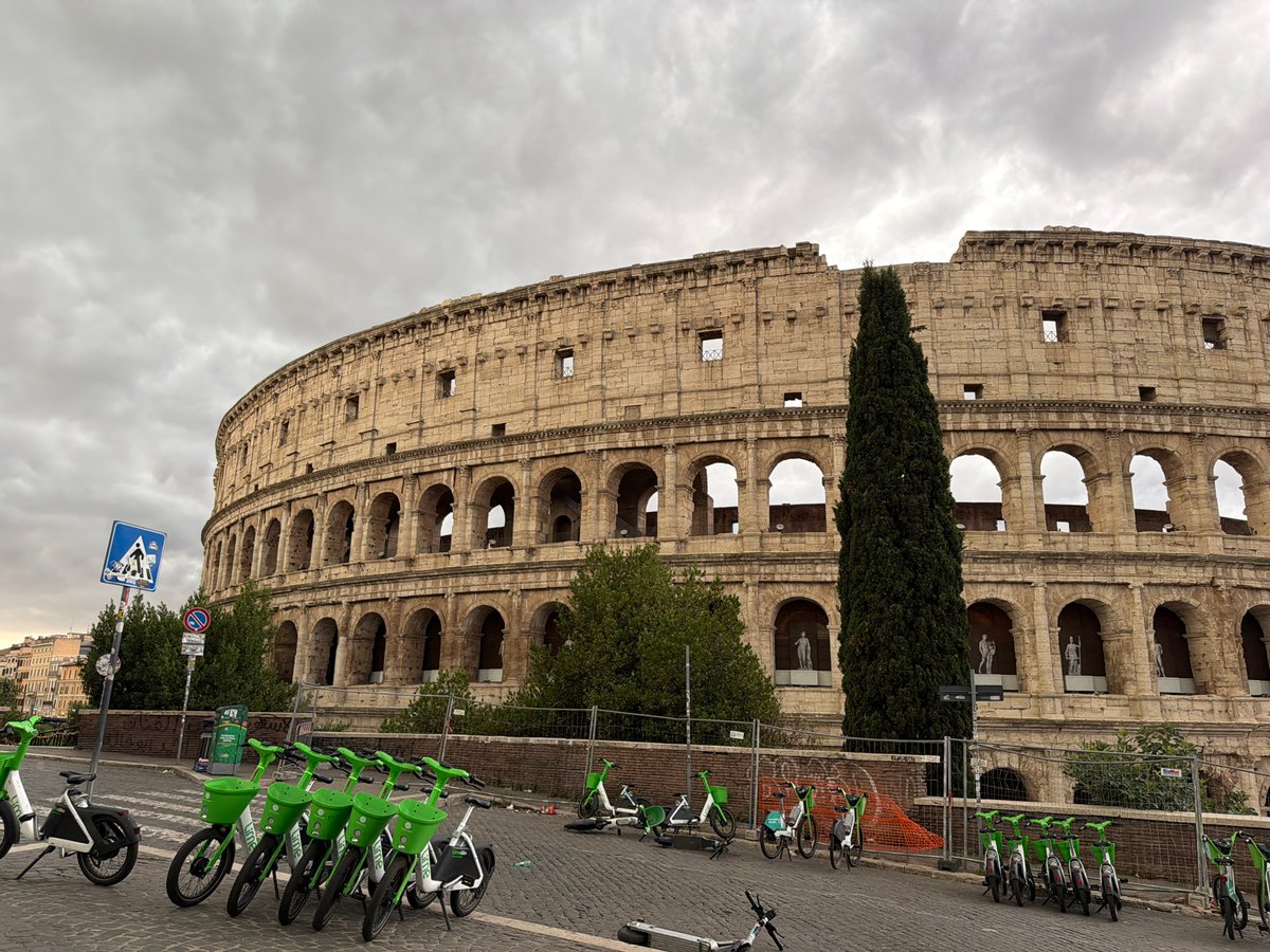 Rome's Colosseum on a cloudy day, seen from all sides