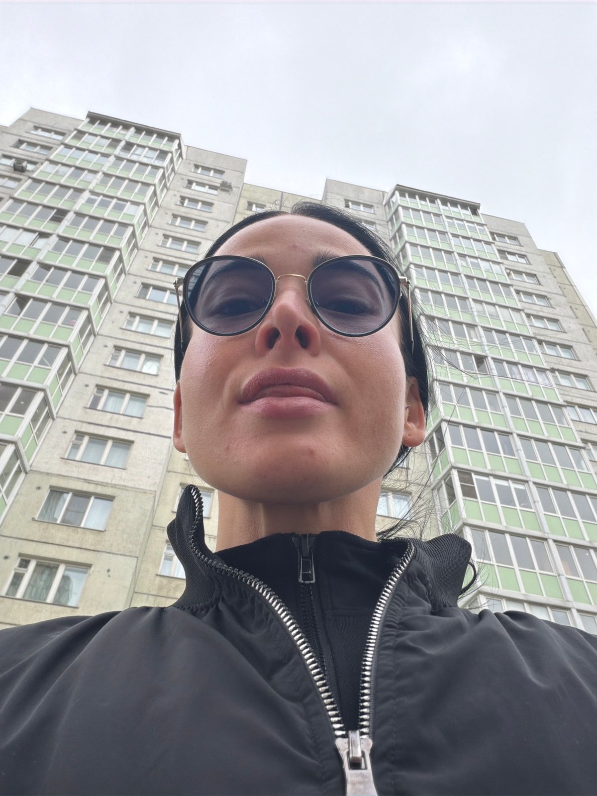 Morning selfie taken outside tall building in Saint Petersburg