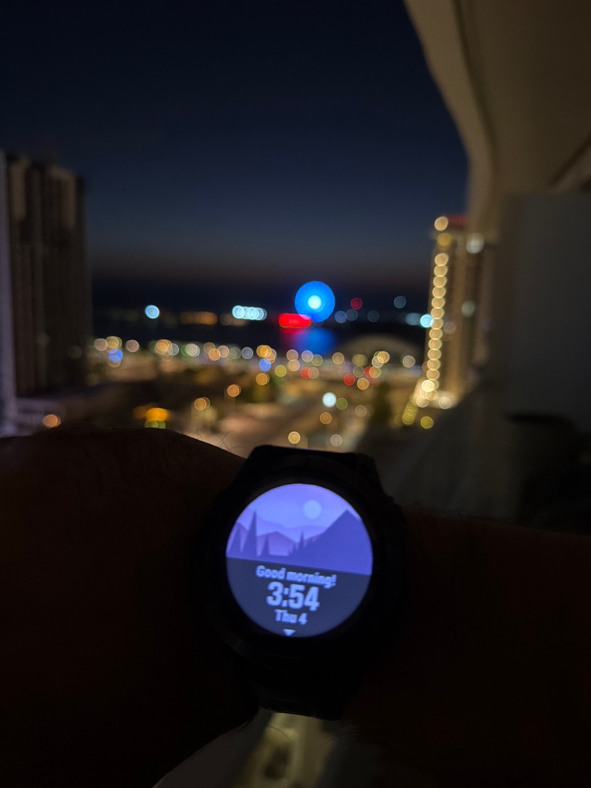 Night observer documents Lusail's illuminated waterfront and Ferris wheel