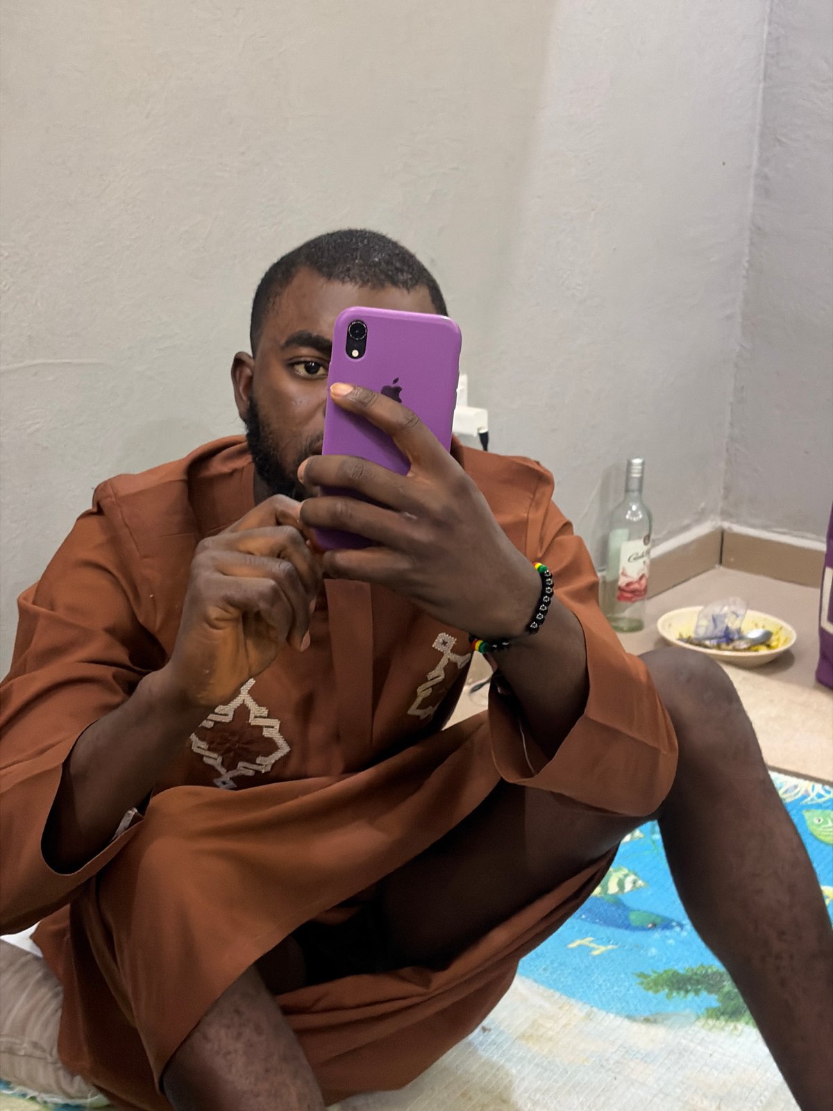 Young men gather for casual indoor meeting in Nigeria