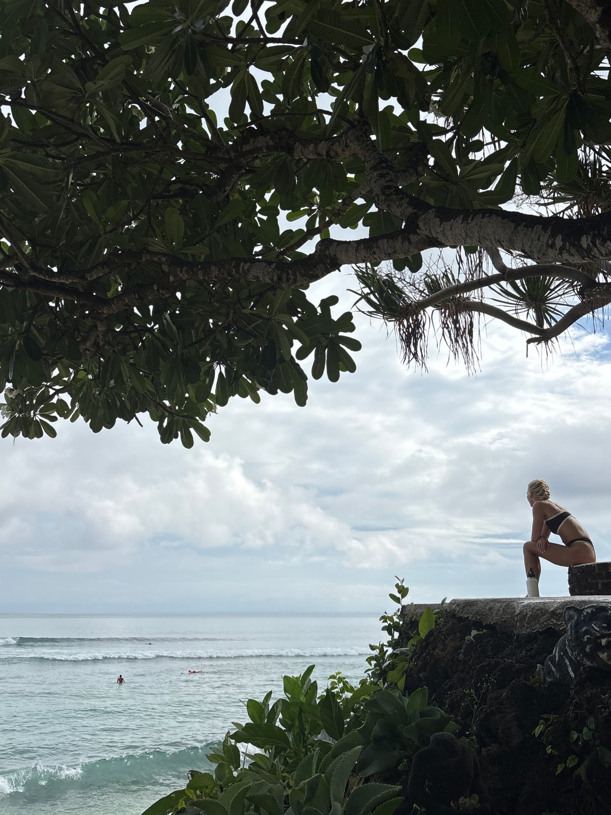 Person enjoys quiet coastal moment in Kuta Selatan