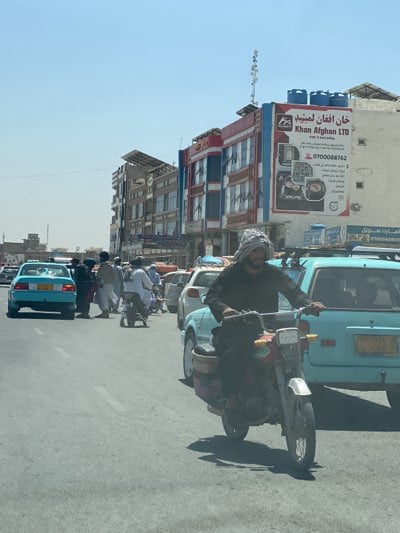 Morning street life documented across commercial Kandahar districts