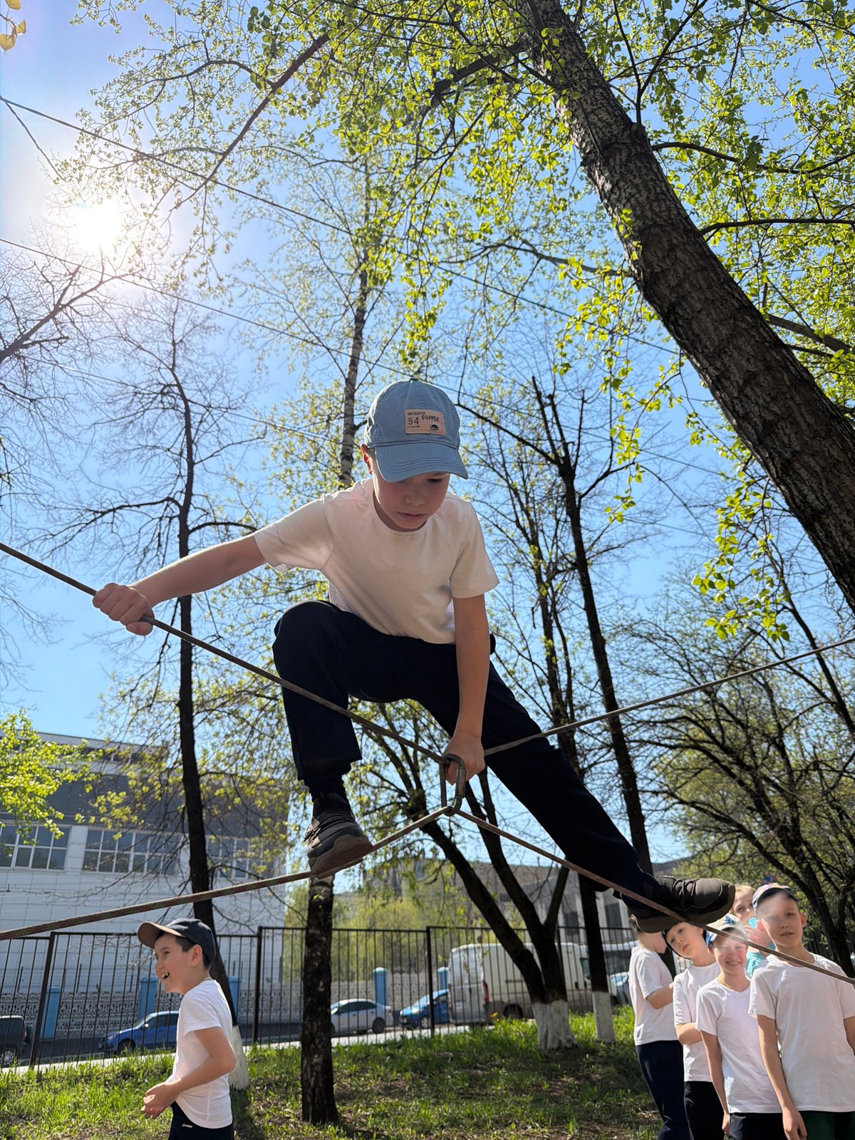 Children participate in rope course activities at Izhevsk park