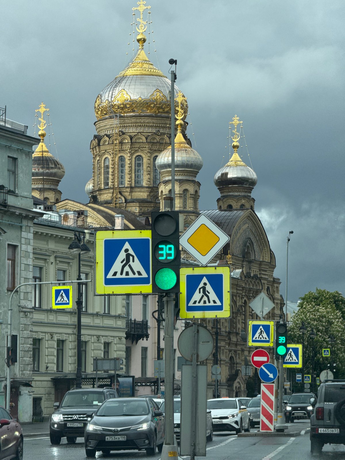 Orthodox cathedral with gilded domes observed in Saint Petersburg
