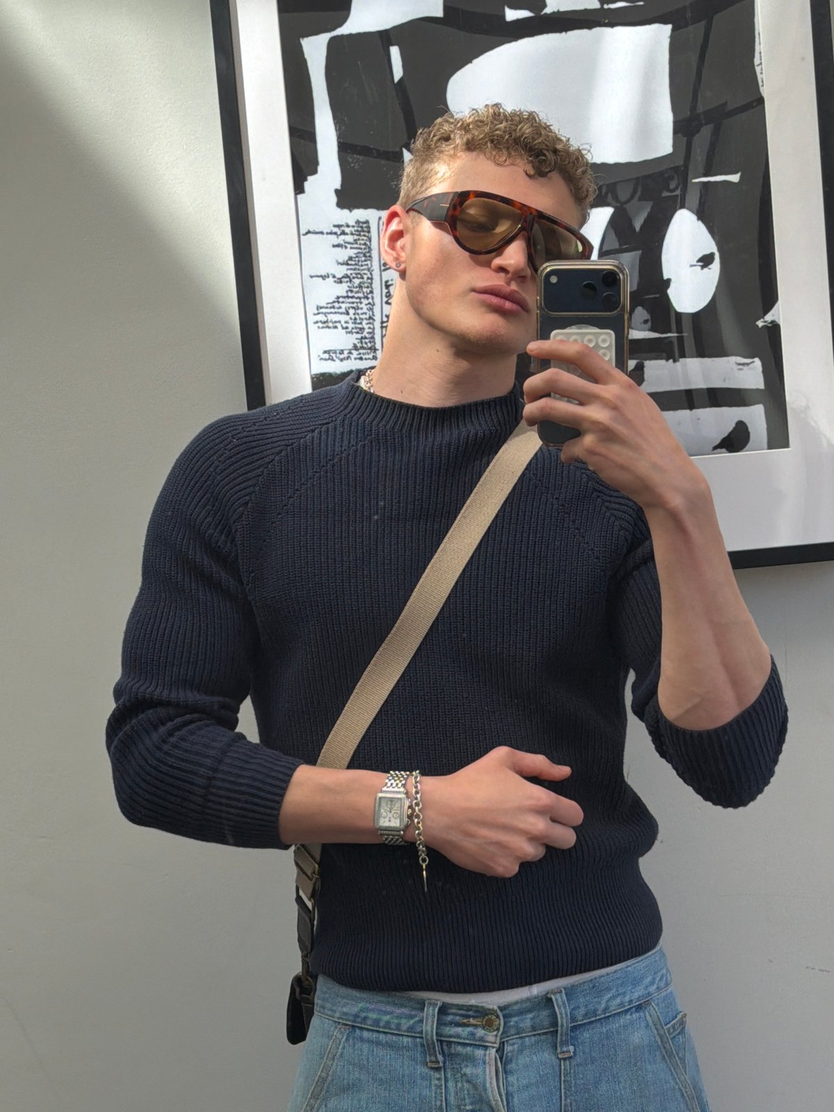 Young man takes mirror selfies in Wandsworth home