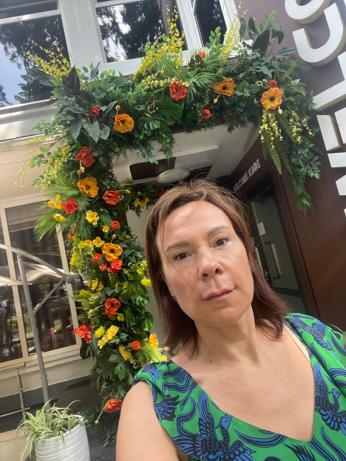 Woman enjoys afternoon tea and flowers in Sochi