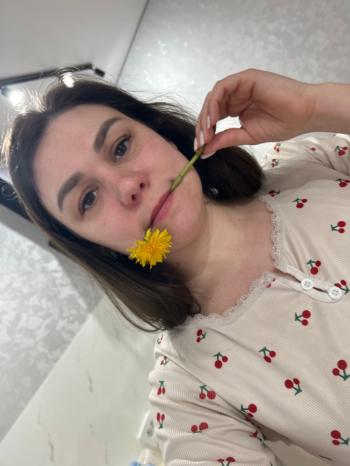 Woman poses with dandelions in springtime photo session