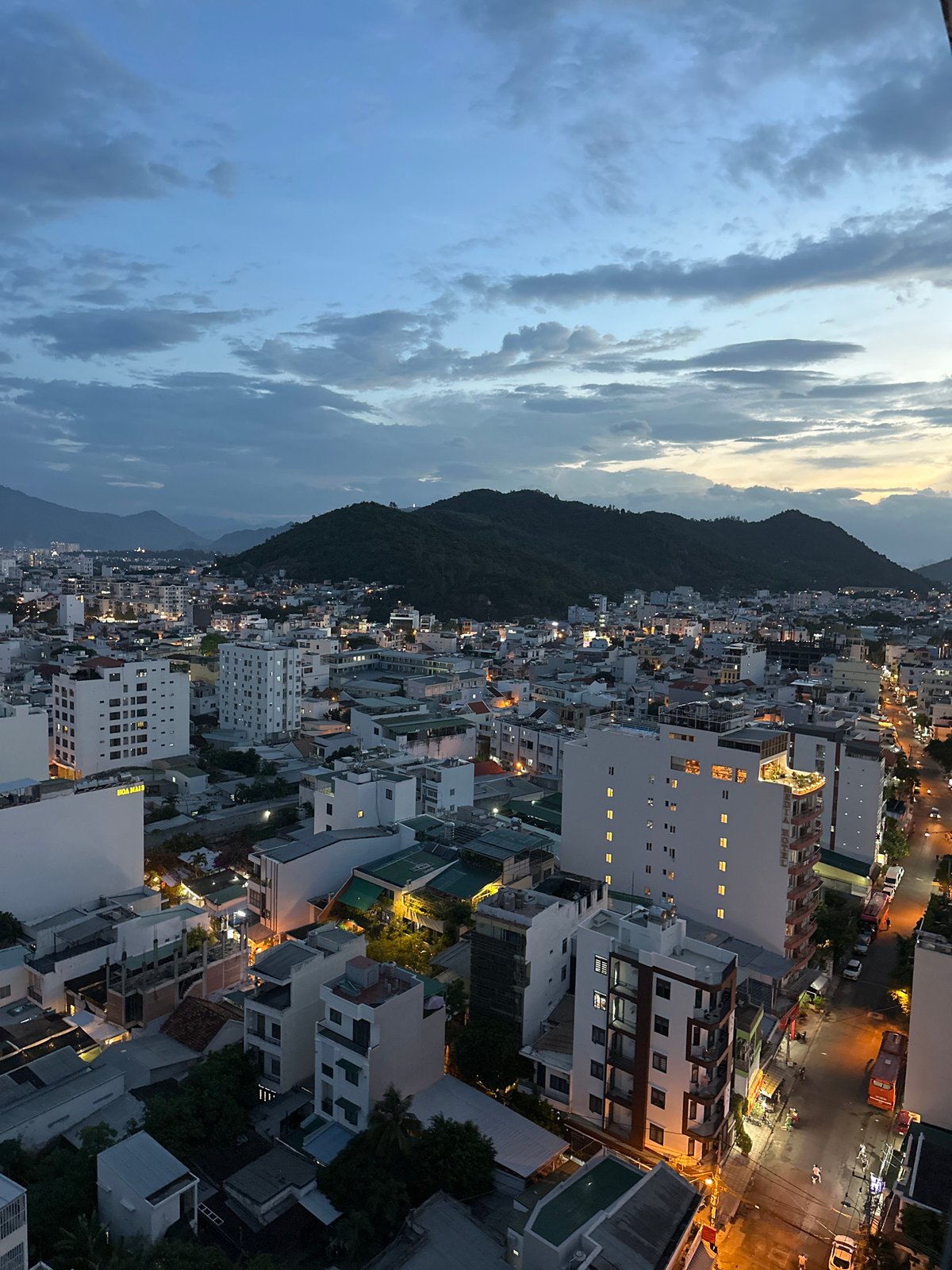 Nha Trang coastal city at dusk, aerial to street level