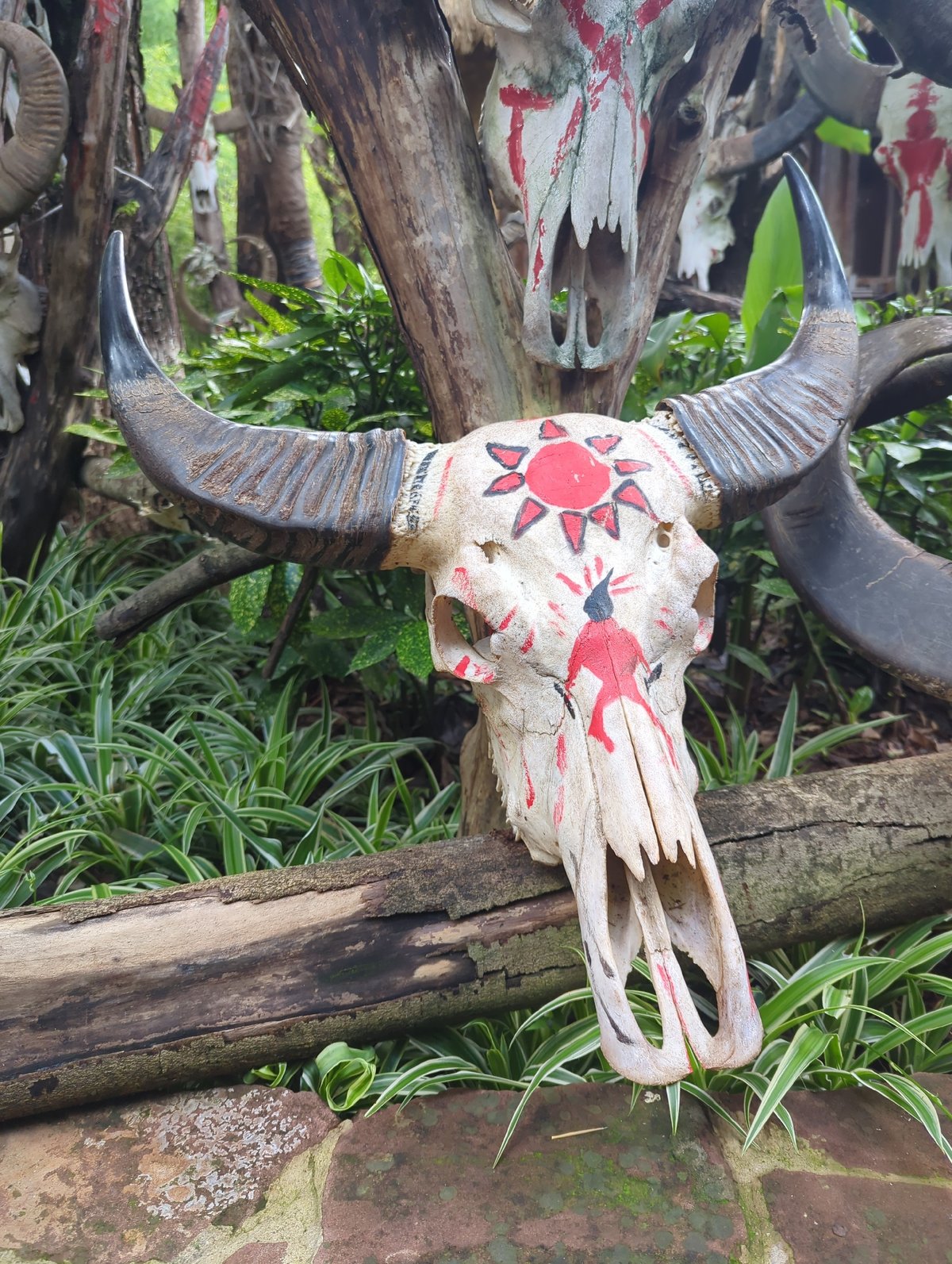 Decorated buffalo skulls and textiles at a Xishan cultural display