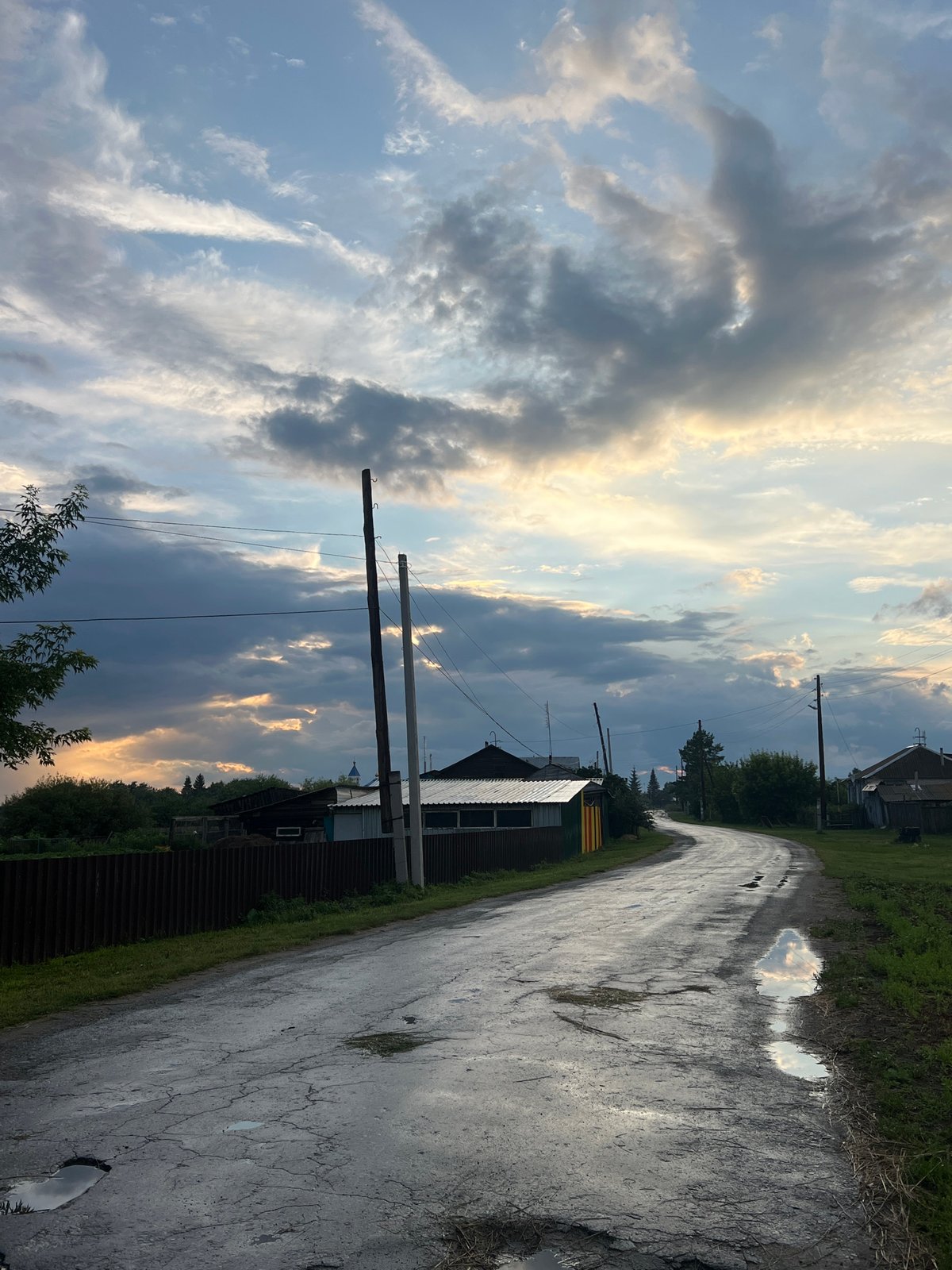 Rainbow over a rainy afternoon in rural Pivkino, Russia